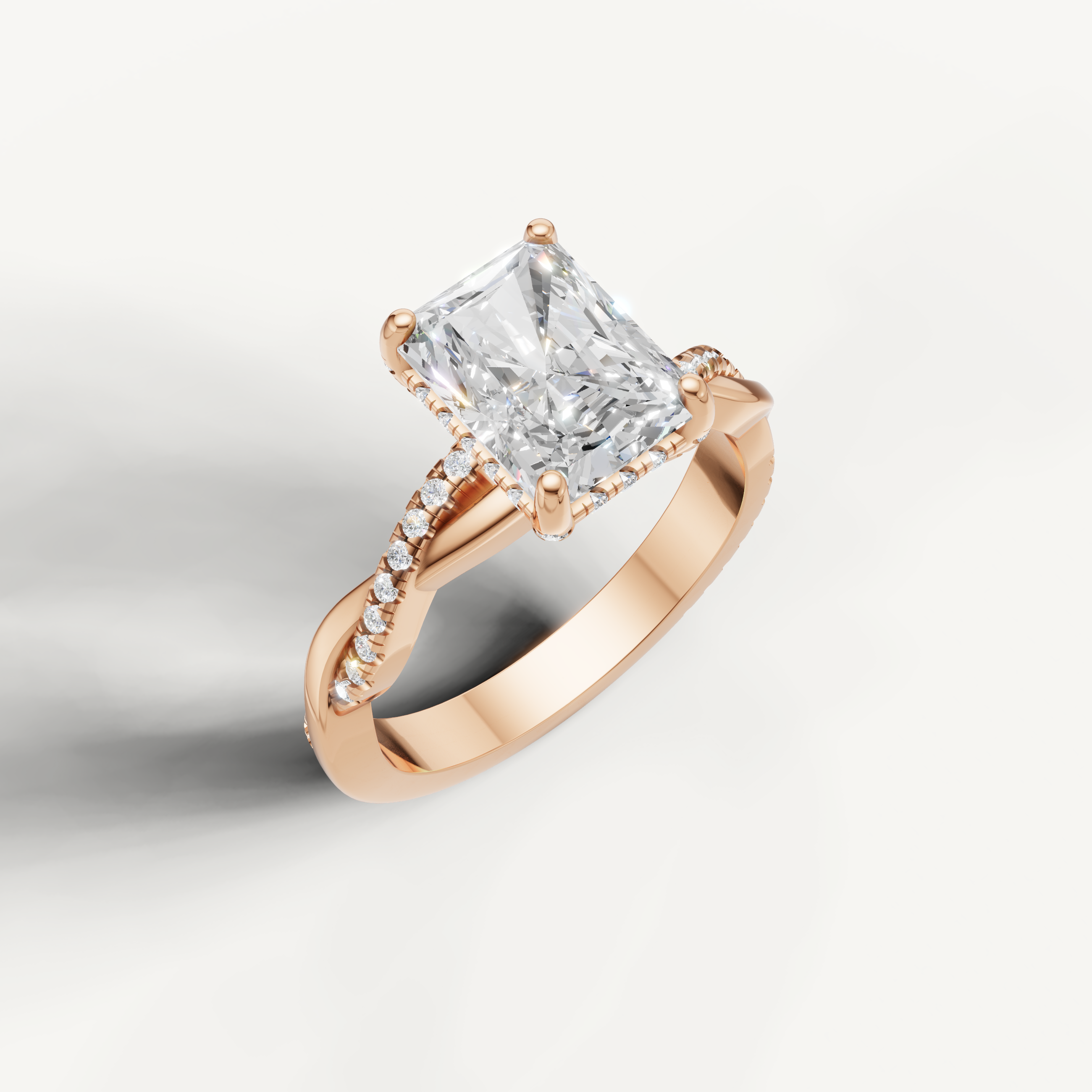 romantic radiant cut lab grown diamond engagement ring in 14k rose gold with twisted pavé split shank