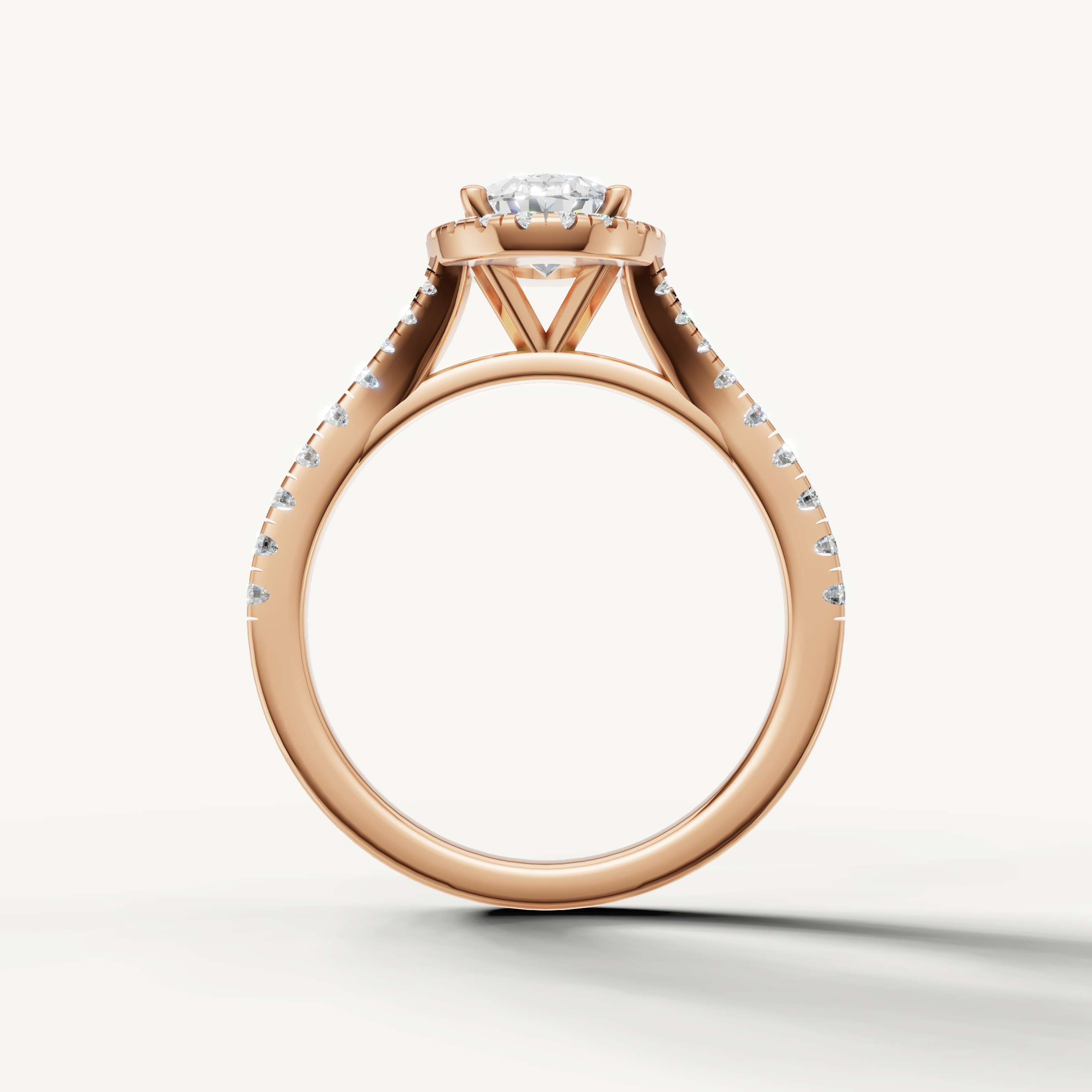 Oval cut engagement ring with halo and pavé band rose gold