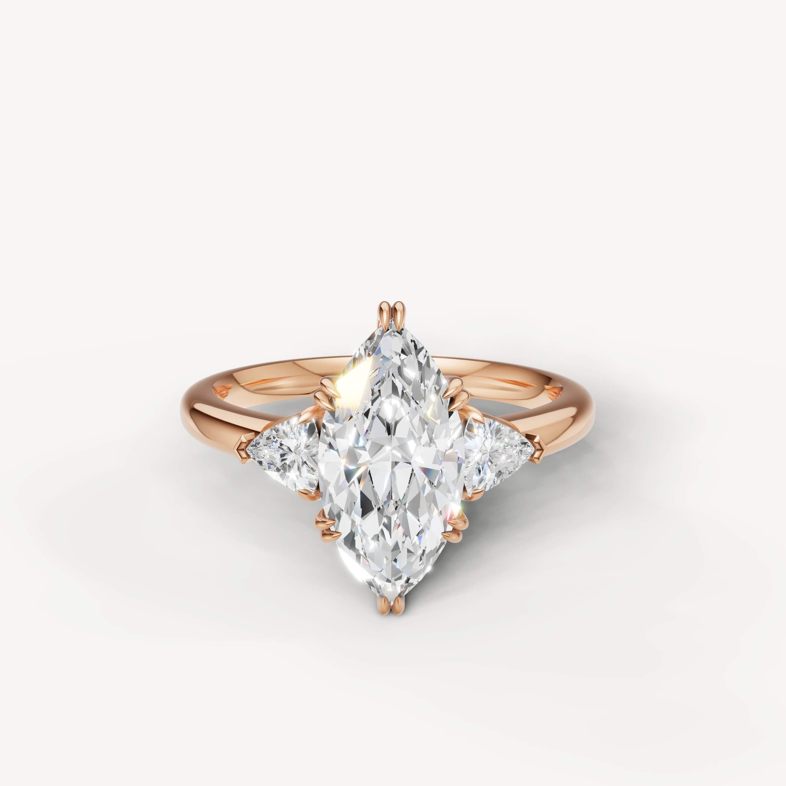 marquise cut lab grown diamond engagement ring with trillion side stones in 14k rose gold