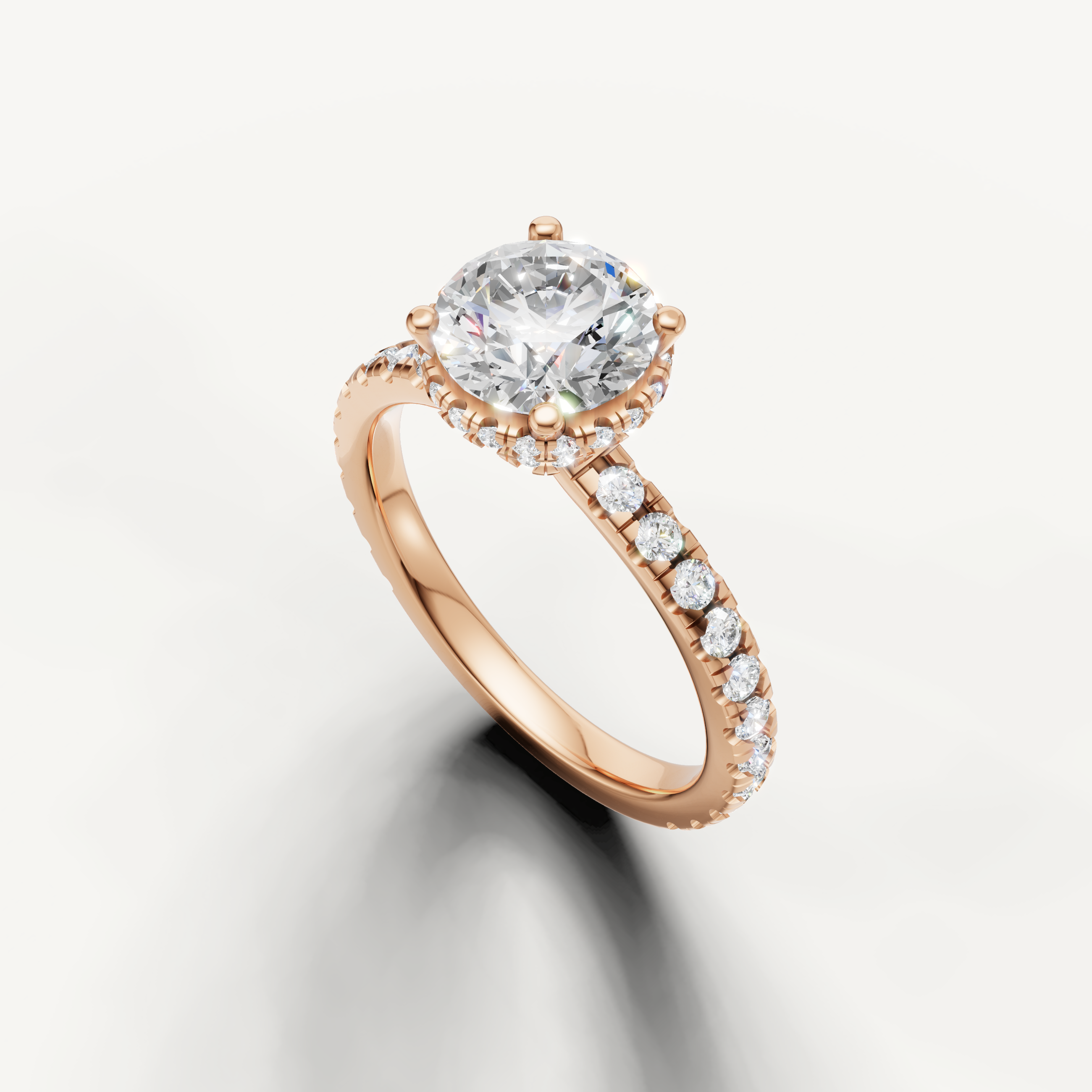 14k rose gold round brilliant lab grown diamond ring featuring hidden halo accents and slim pavé diamond band