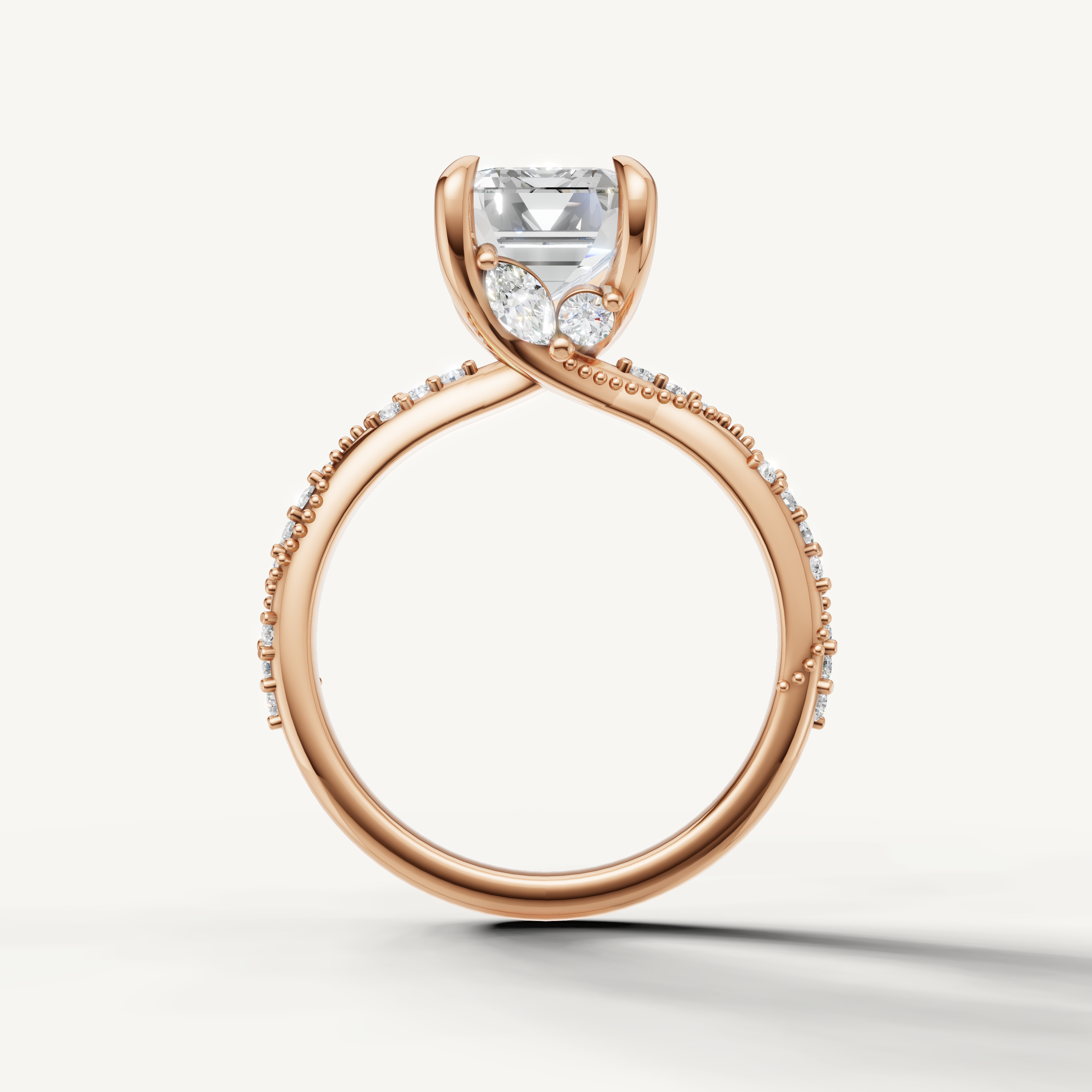 emerald cut lab grown diamond ring with elegant twisted shank pavé band rose gold