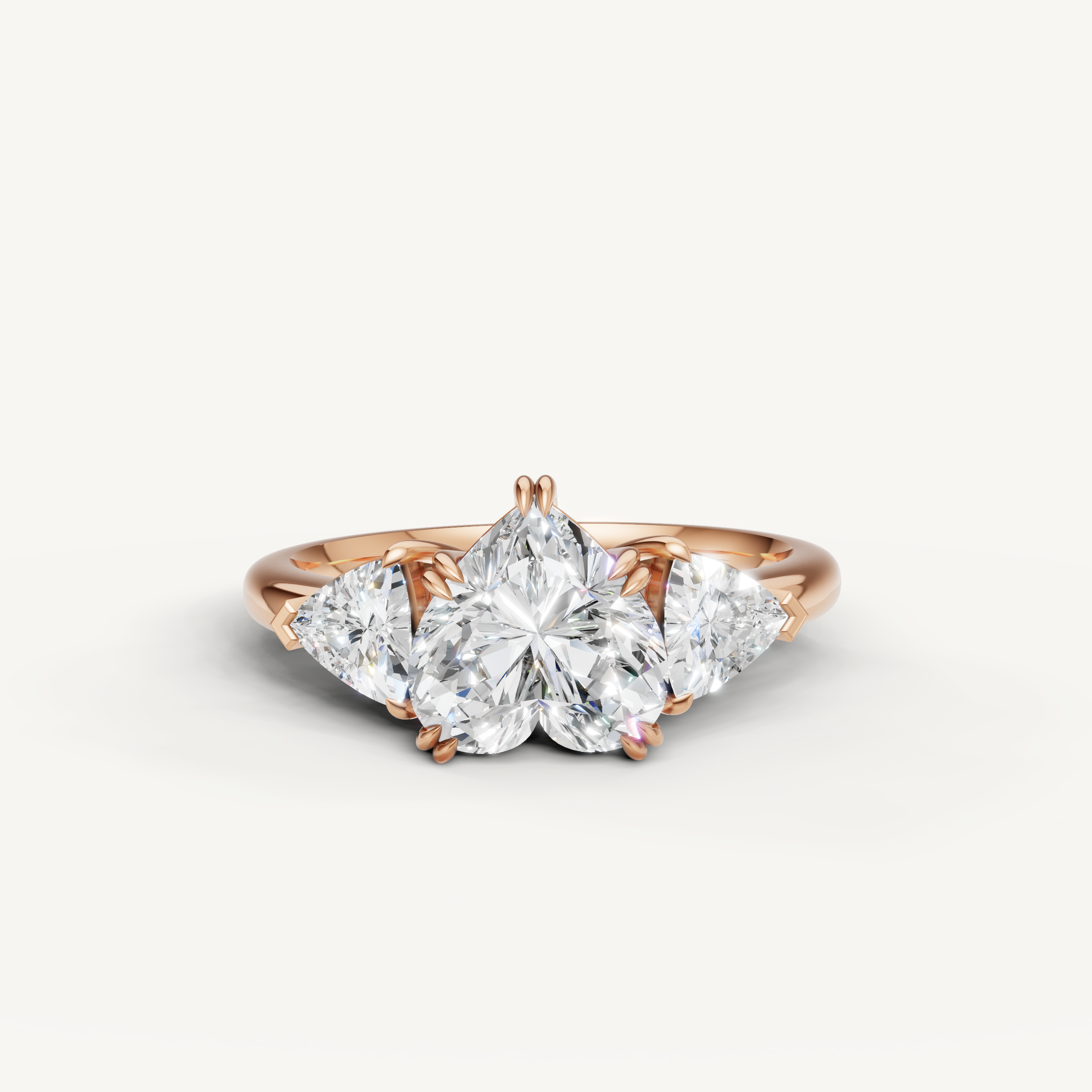 heart cut lab grown diamond engagement ring with trillion side stones in 14k rose gold