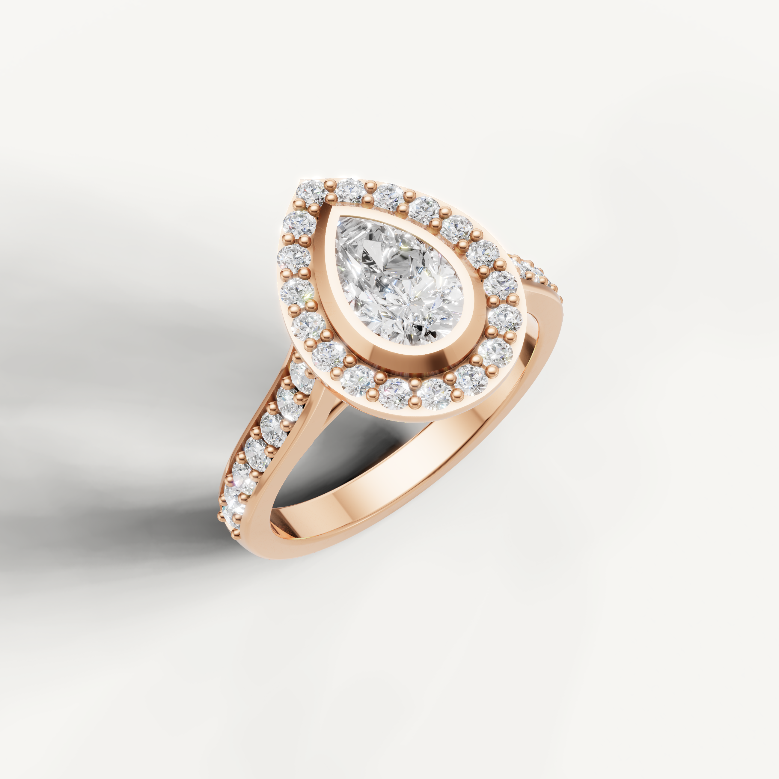 Pear cut halo diamond ring in rose gold by Raul Diamonds