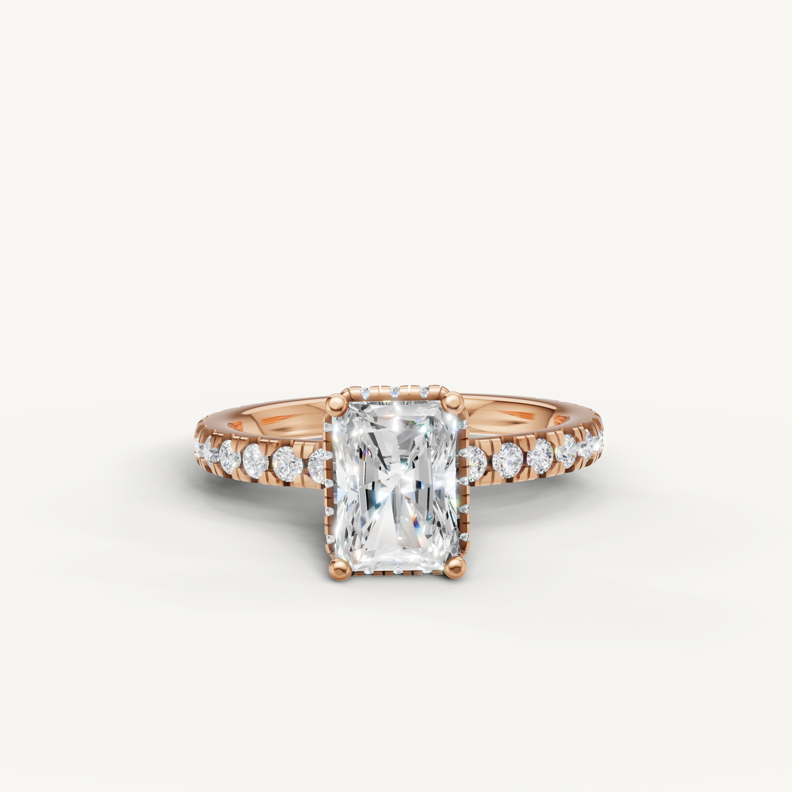 radiant cut lab grown diamond hidden halo engagement ring in 14k rose gold with shimmering pavé diamond band