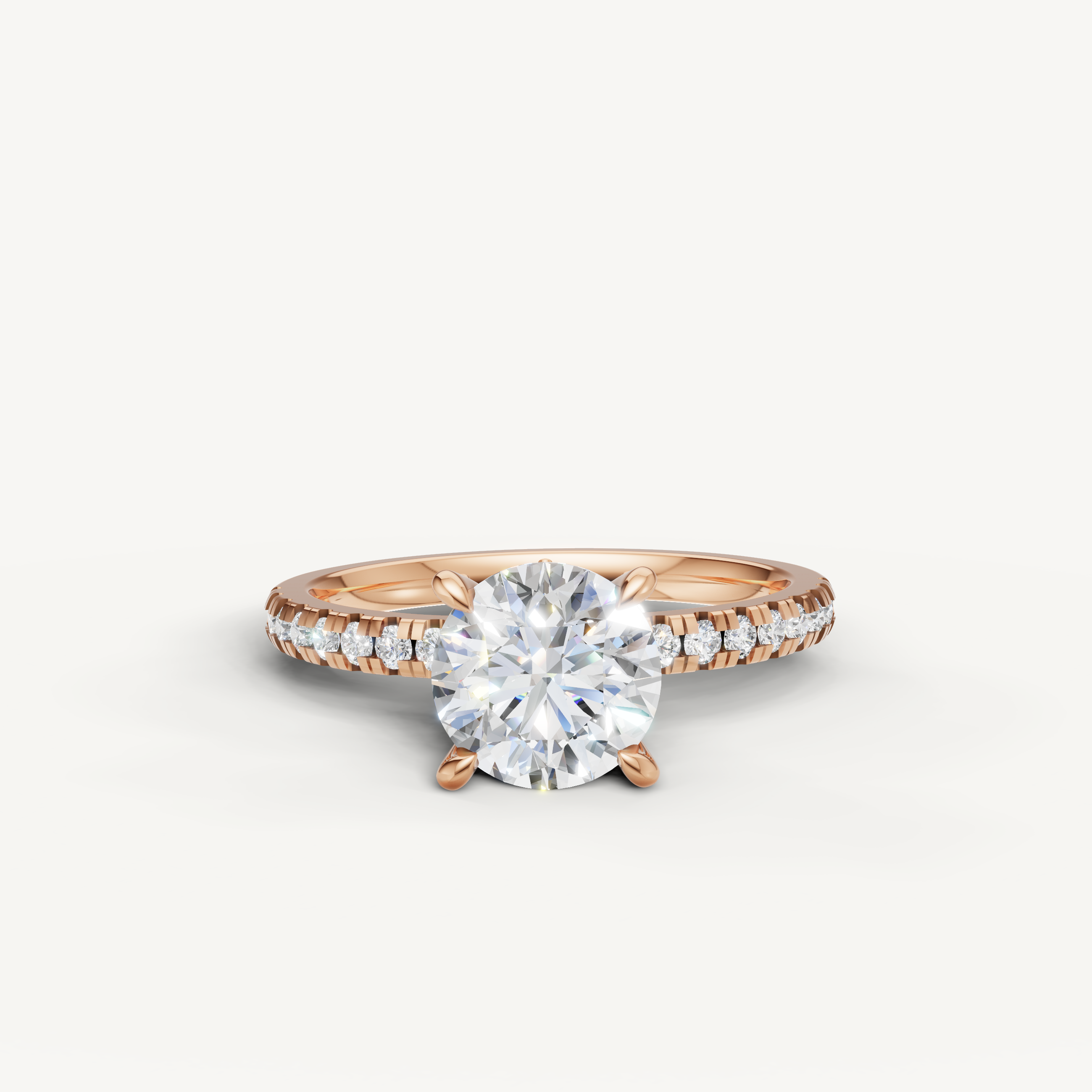 Romantic rose gold round cut diamond engagement ring with a brilliant pavé-set diamond band.