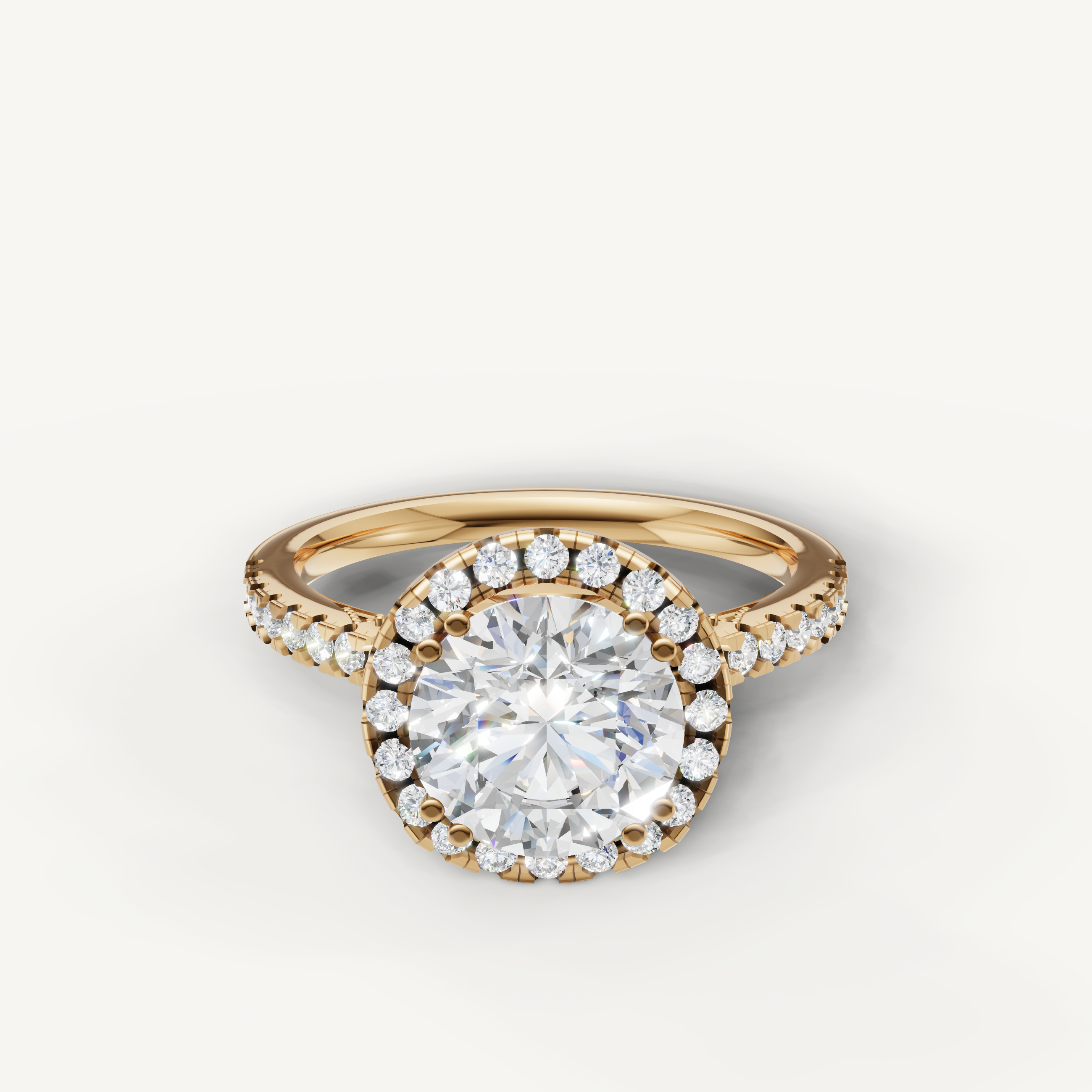 Round cut lab grown diamond halo engagement ring in 14K yellow gold with pavé diamond band by Raul Diamonds