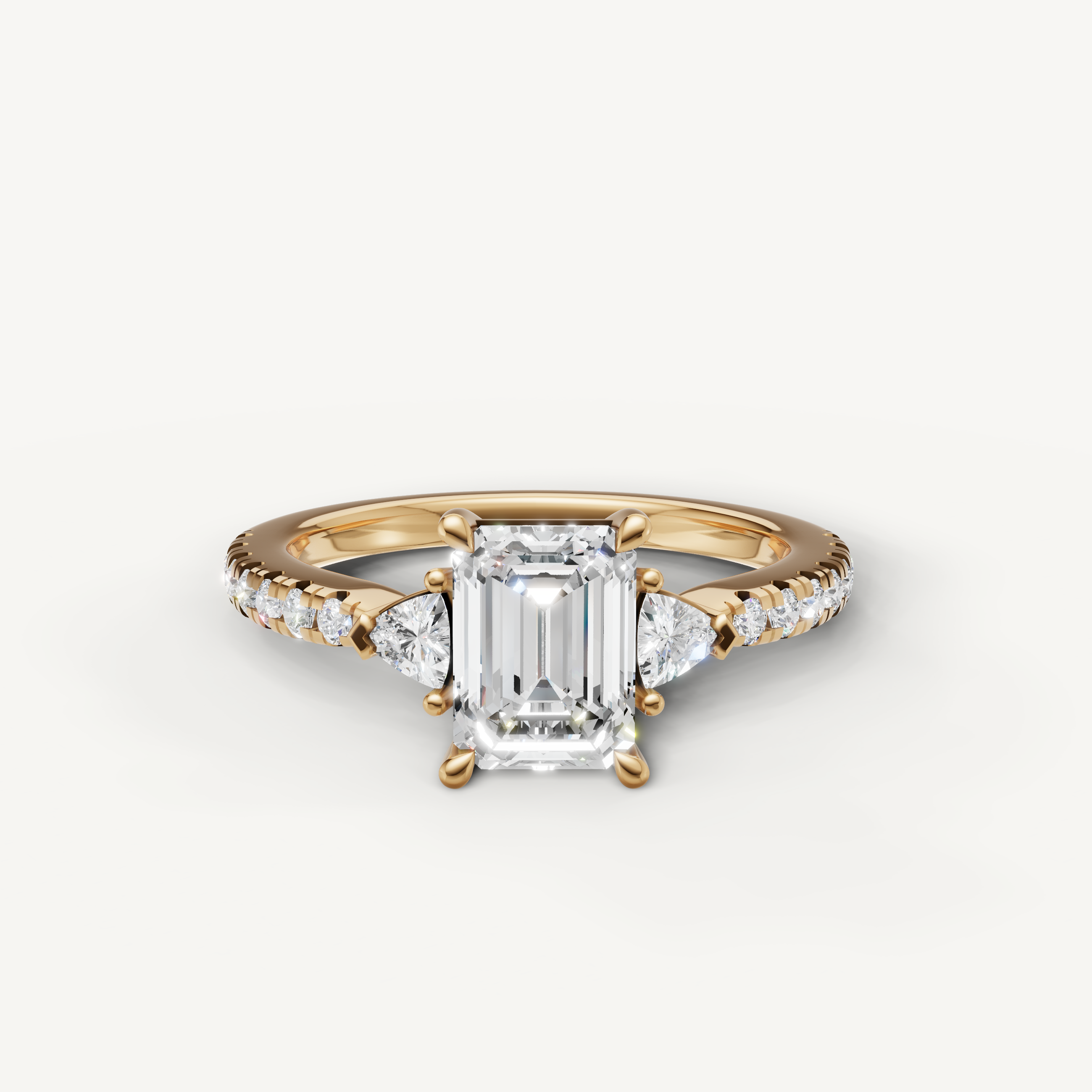 Emerald cut lab grown diamond engagement ring in 14K yellow gold with pavé band and side stones