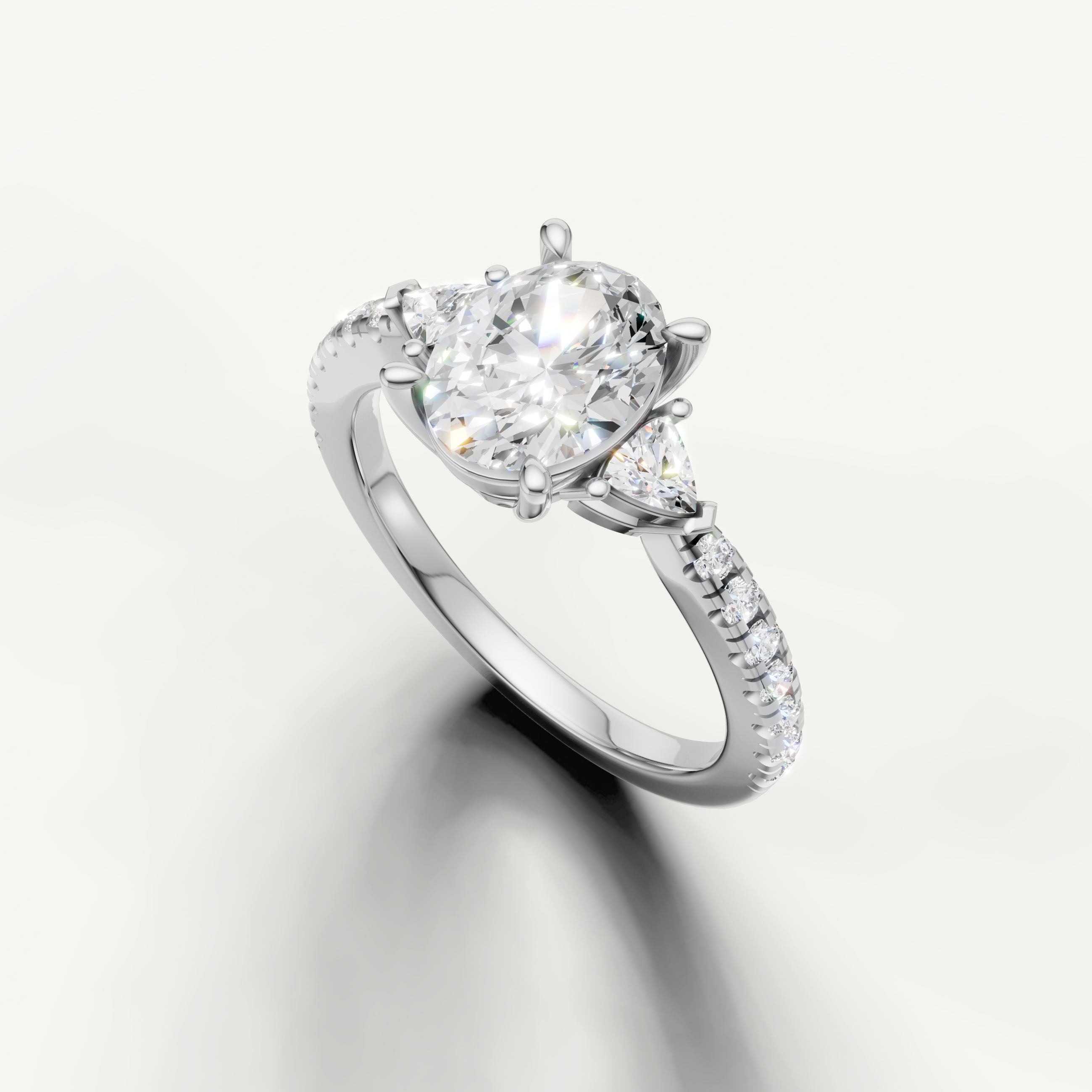 timeless-white-gold-oval-diamond-ring-trillion-accents
