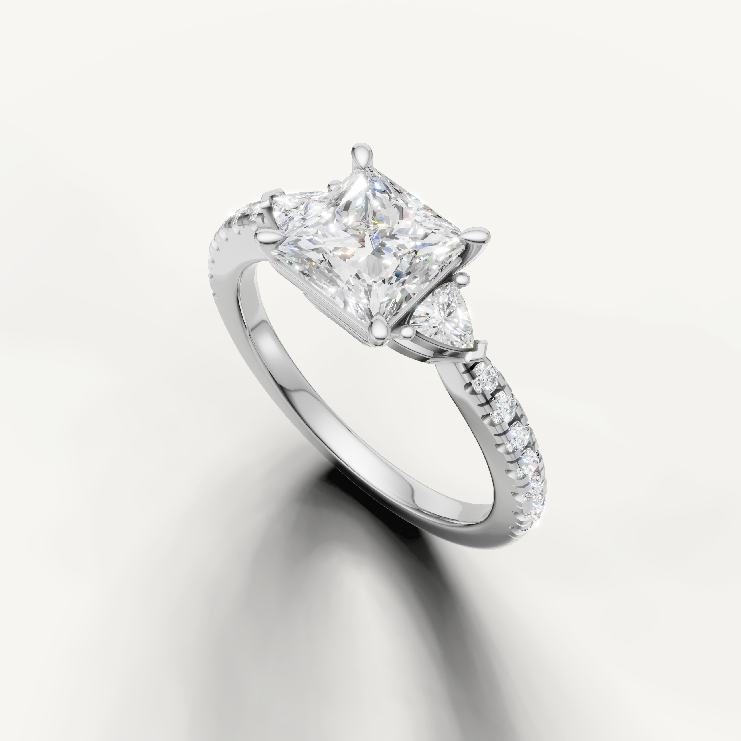 Princess cut three-stone lab grown diamond engagement ring in white gold with slim pavé band