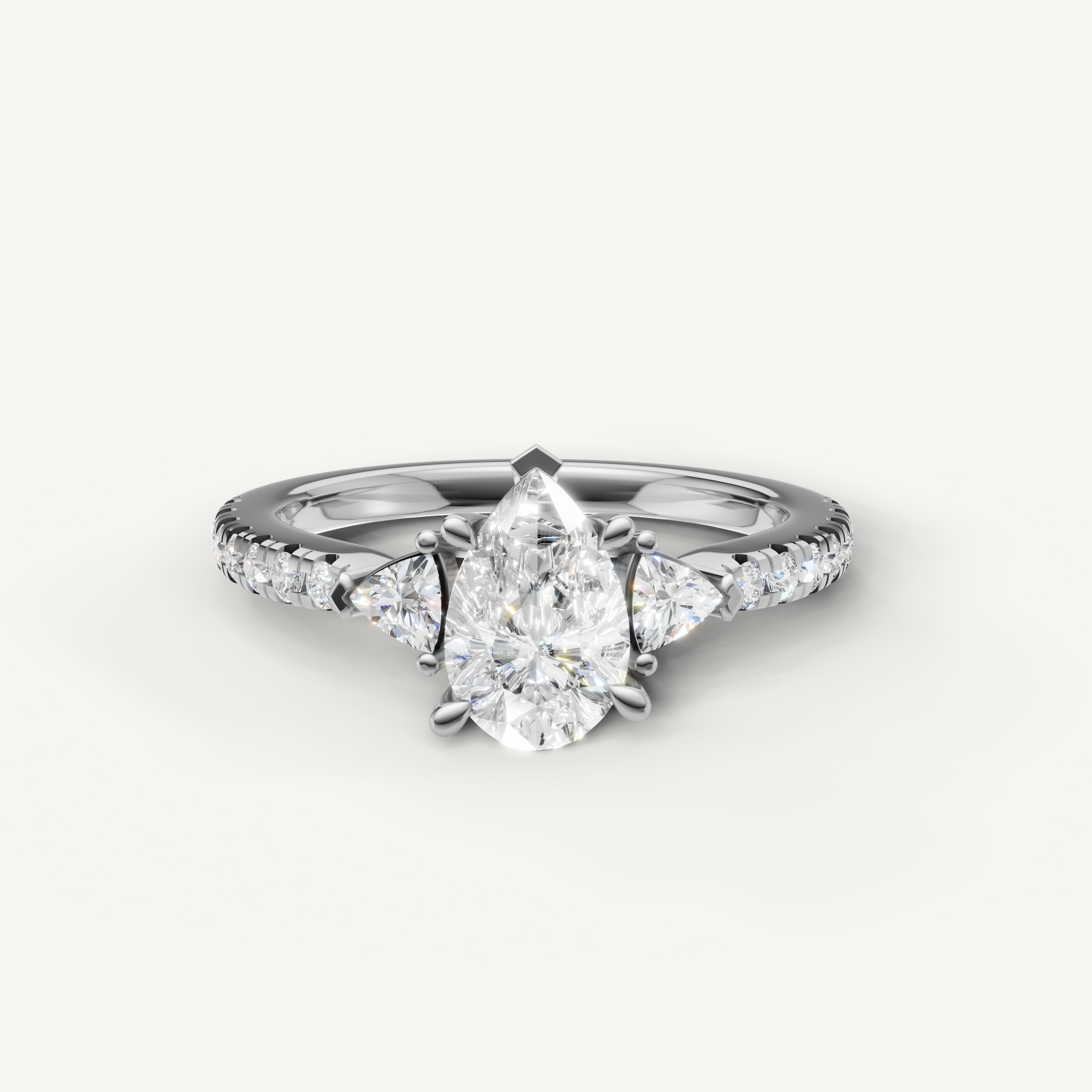 Pear cut lab grown diamond engagement ring in 14K white gold with pavé band and side stones