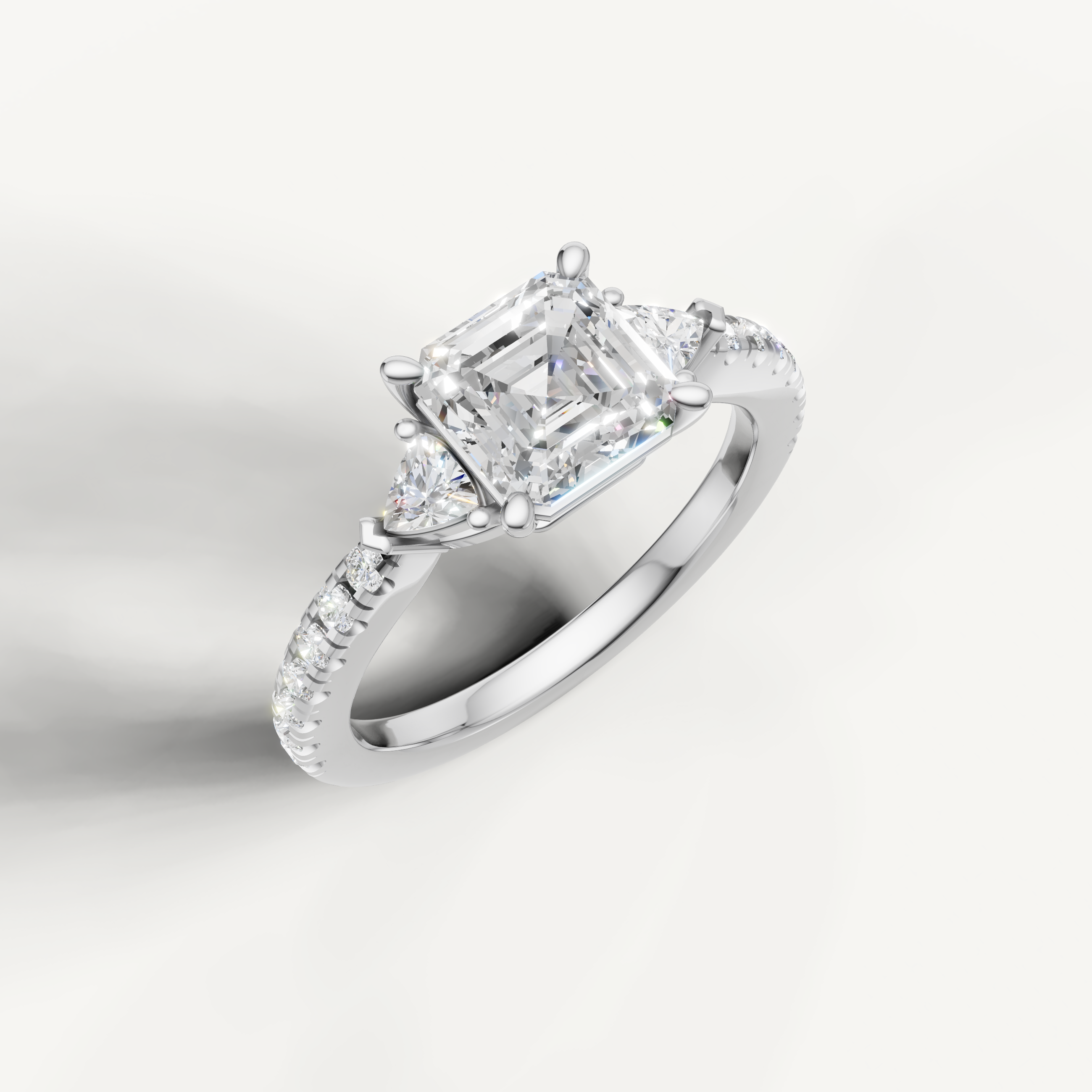 Luxury three-stone engagement ring with Asscher cut lab grown diamond in 14K gold
