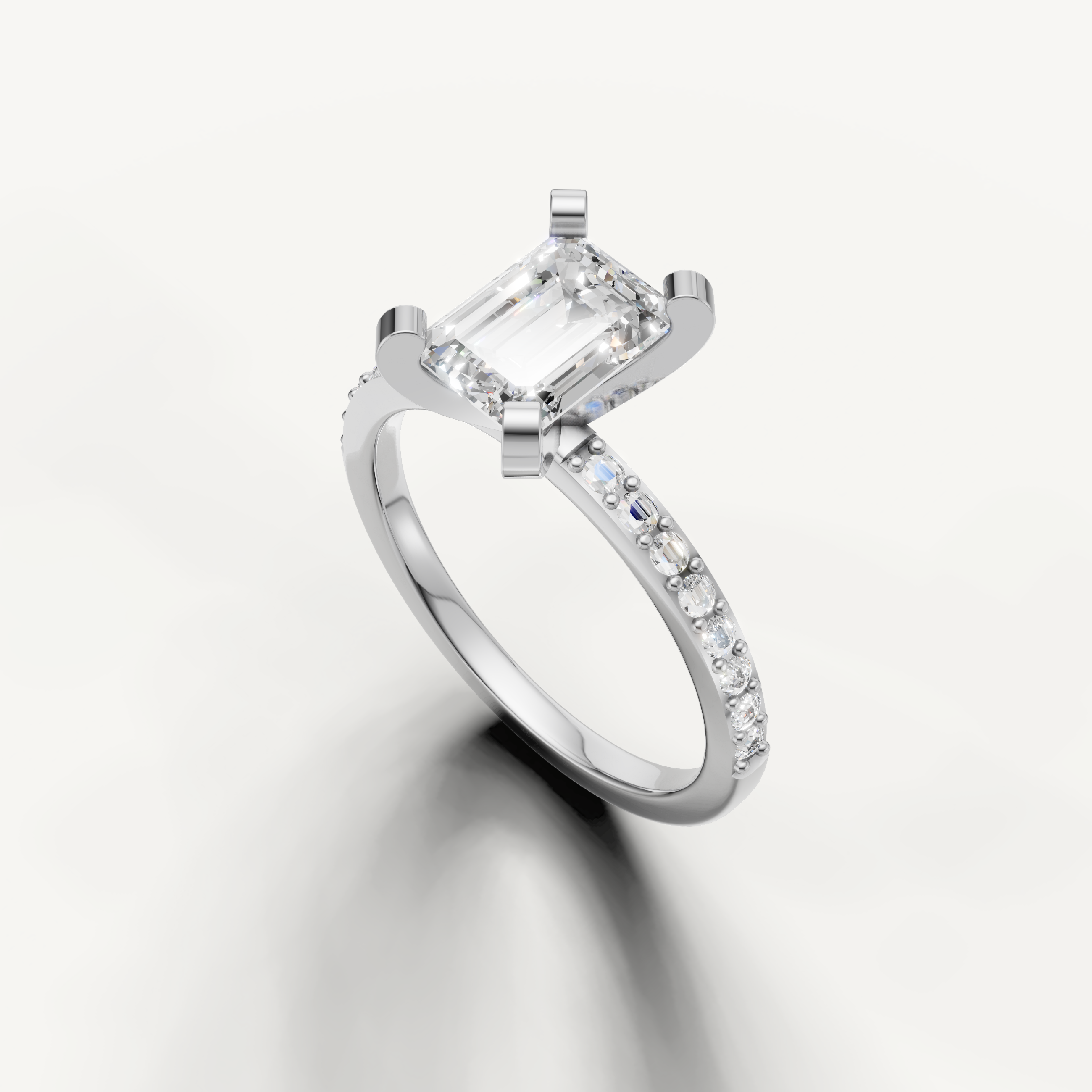 Elongated emerald cut diamond ring in white gold with micro pavé diamonds