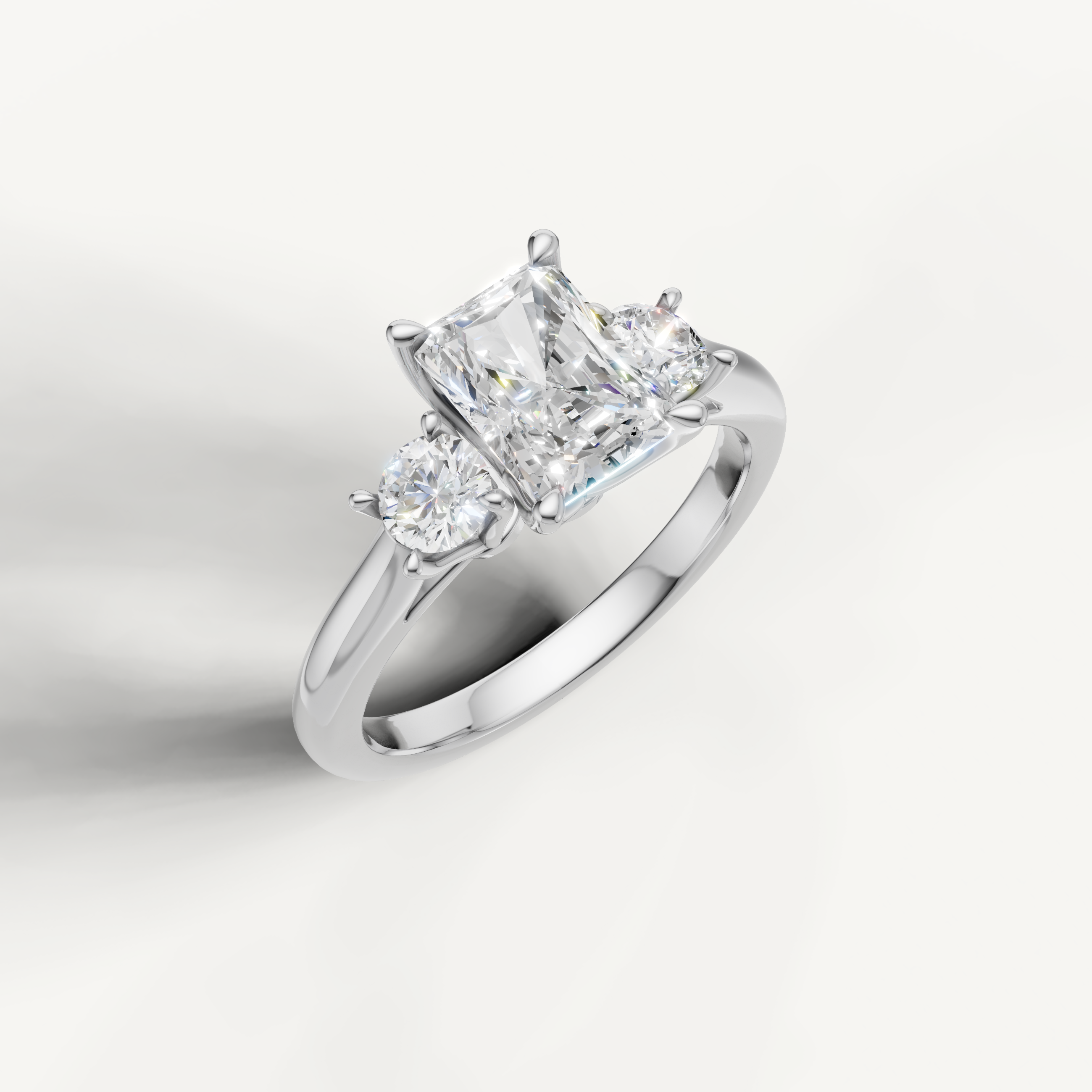 IGI certified radiant lab diamond ring with round side stones white gold DEF VVS