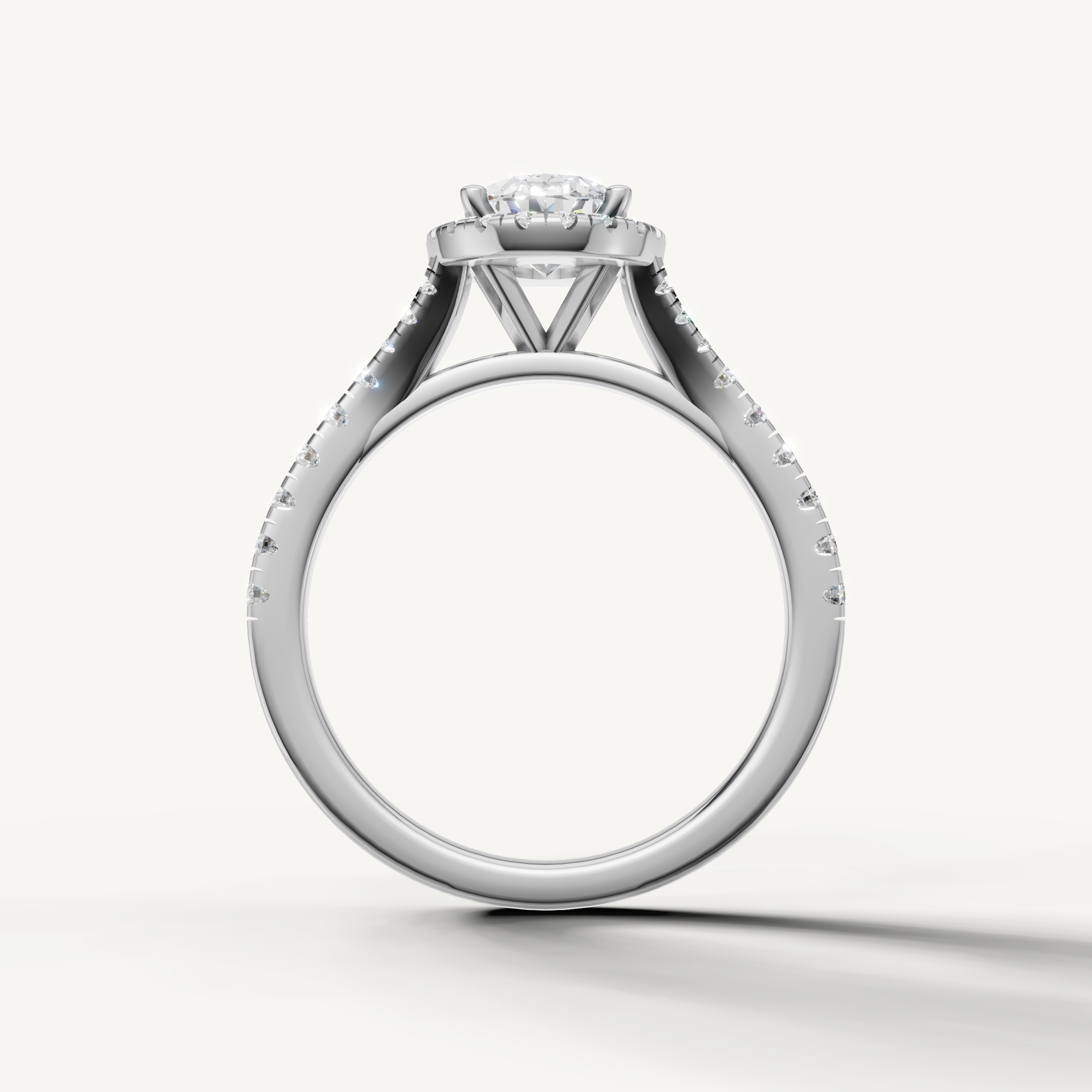 Oval cut engagement ring with halo and pavé band white gold