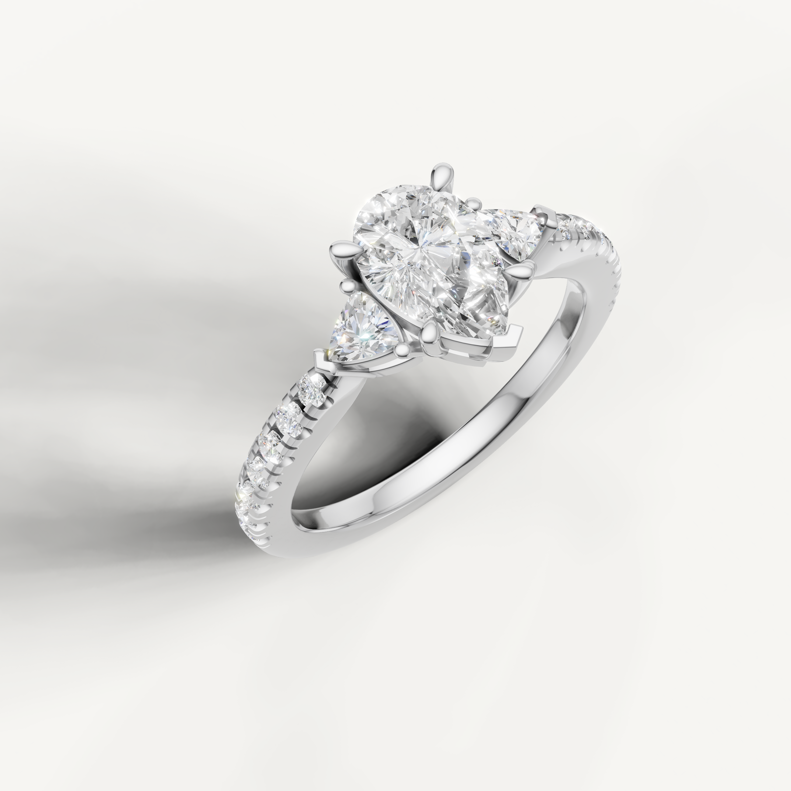 14K white gold pear shape lab grown diamond ring with tapered side diamonds and pavé setting