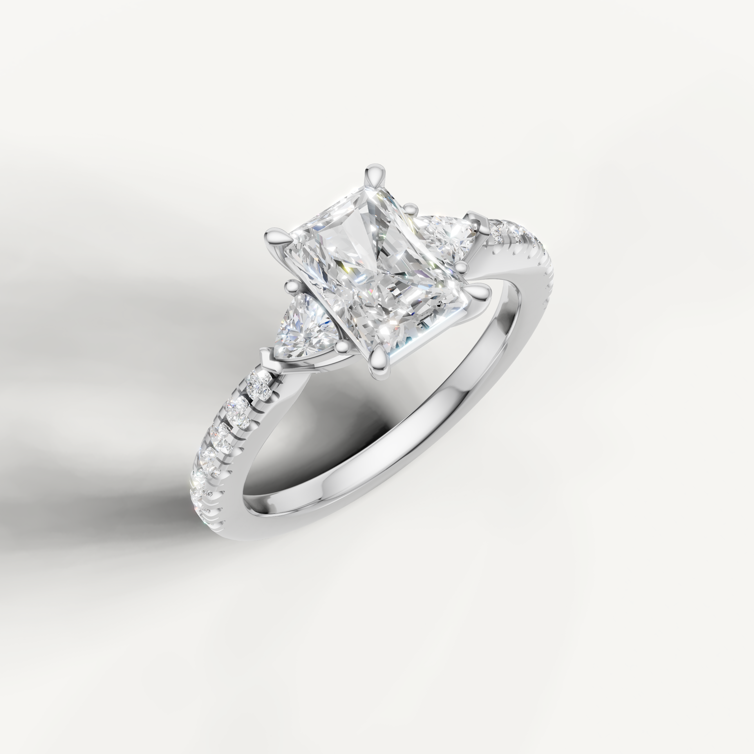 14K white gold radiant cut lab grown diamond ring with tapered side diamonds and pavé setting