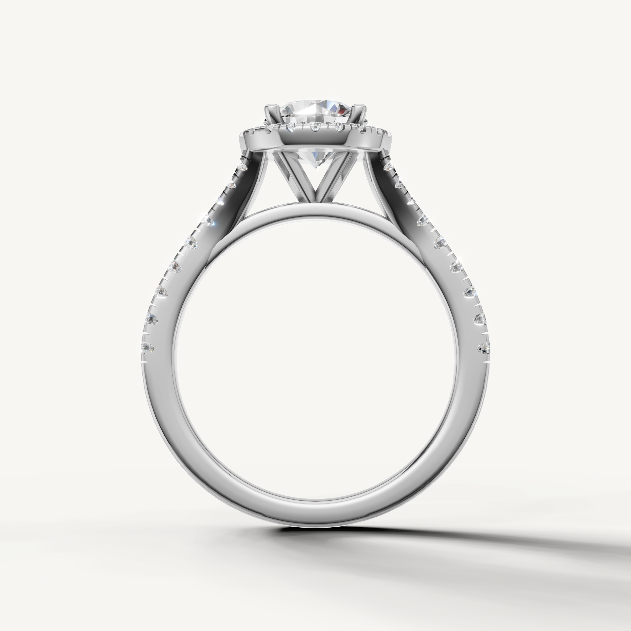 Round cut engagement ring with halo and pavé band white gold