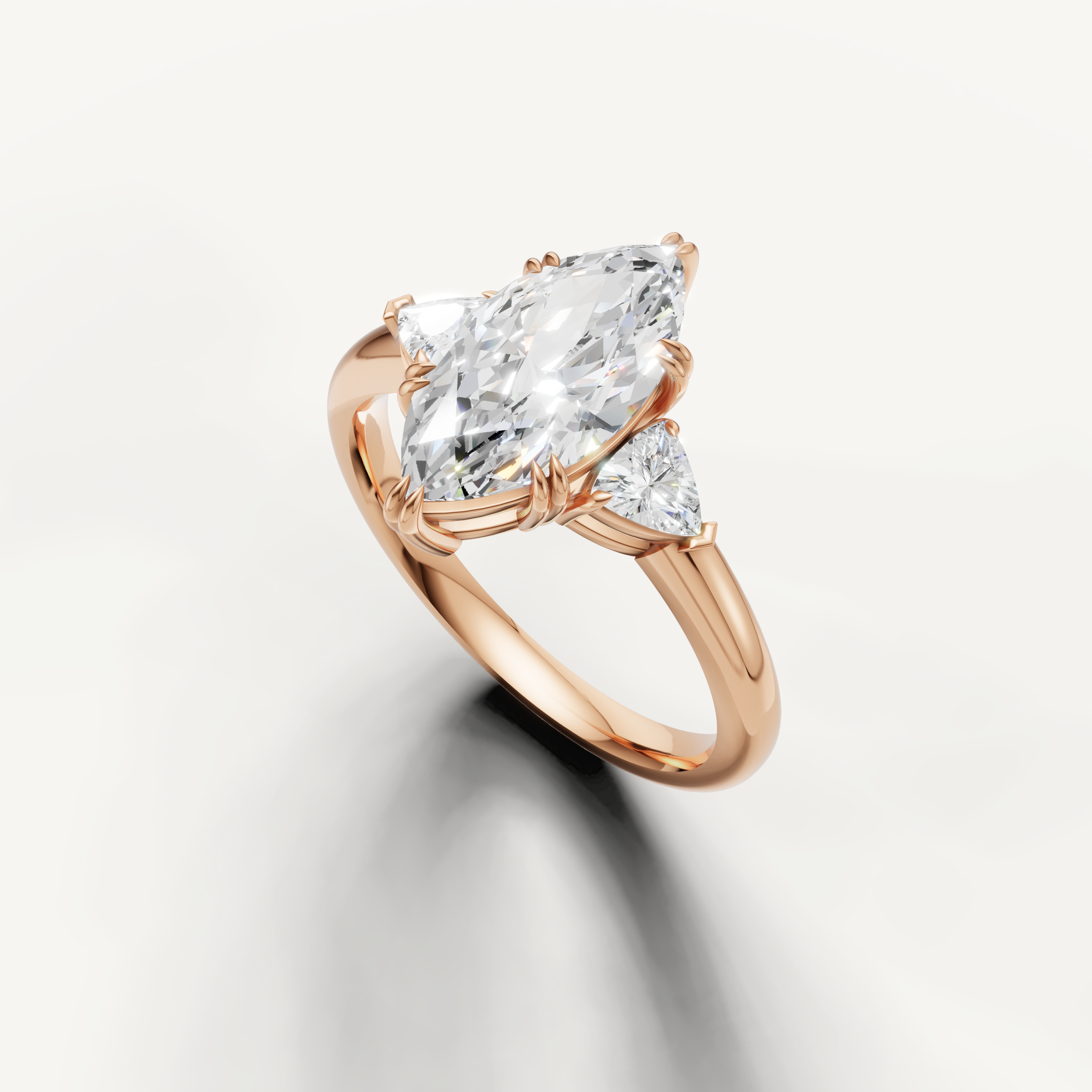 elegant marquise cut lab grown diamond ring with polished rose gold and trillion diamonds