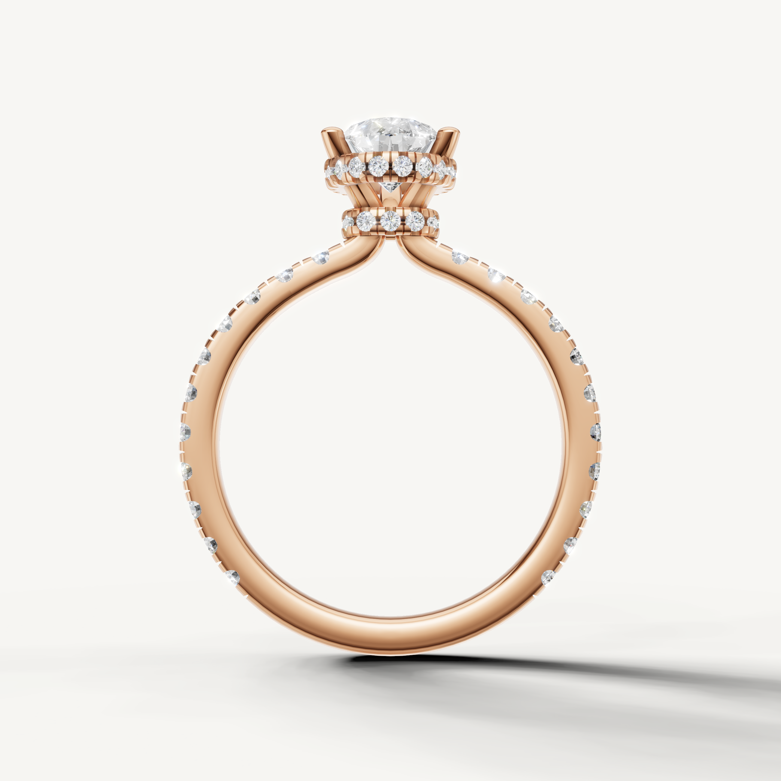 elegant pear shaped lab grown diamond hidden halo ring in 14k rose gold with modern pavé diamond design