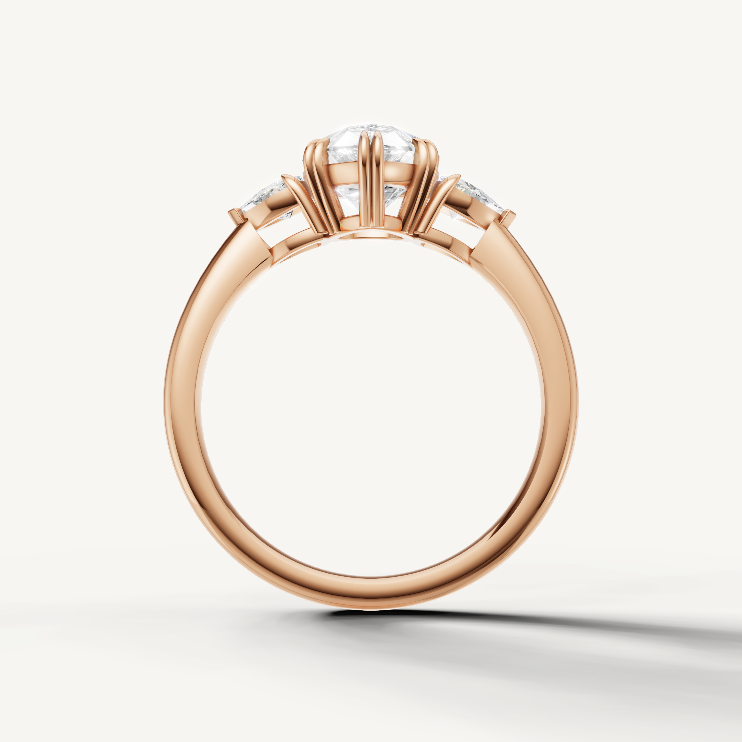 timeless pear shaped lab grown diamond engagement ring with trillion accents in 14k rose gold