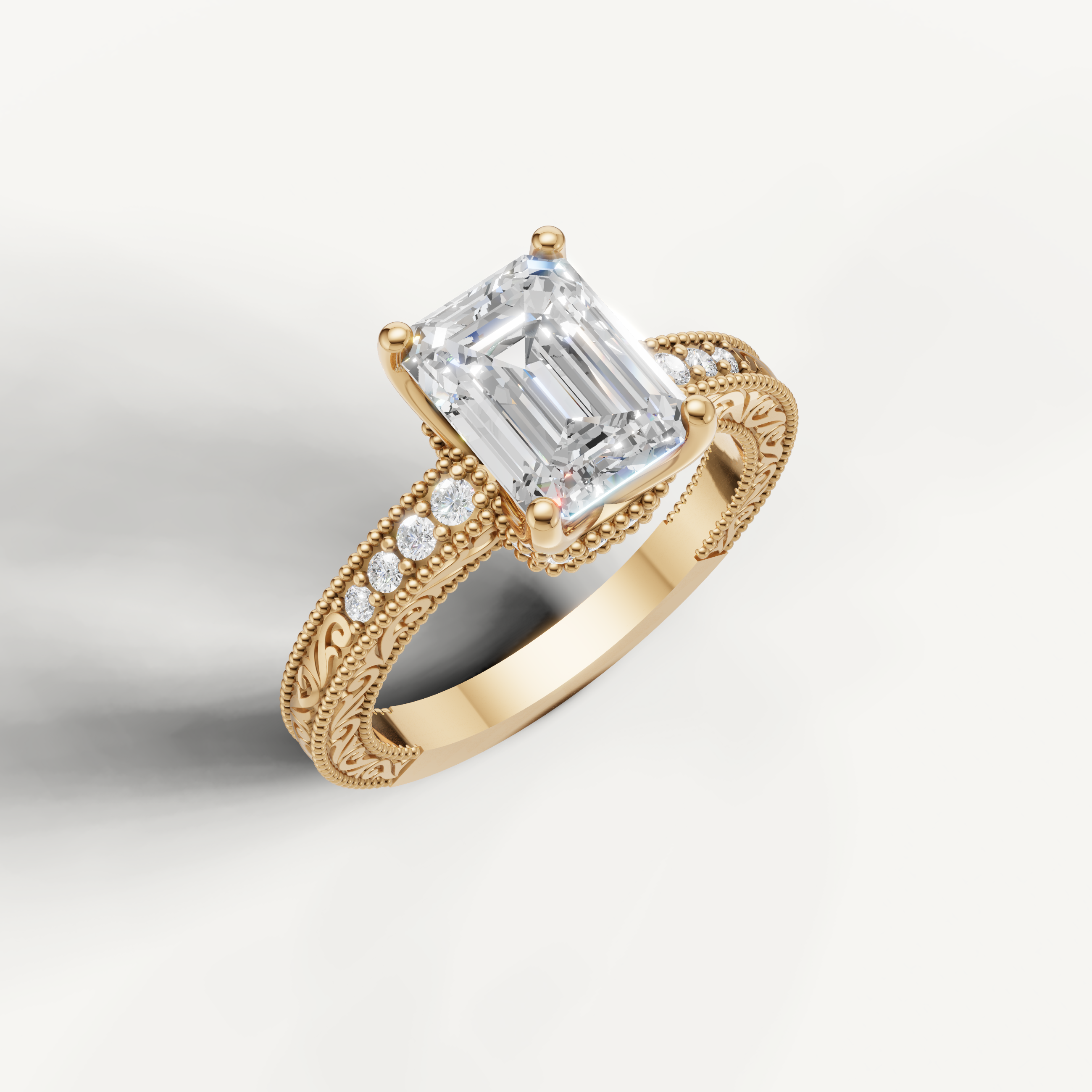 Emerald cut lab grown diamond ring in yellow gold featuring antique-inspired scrollwork and detailed milgrain craftsmanship by Raul Diamonds.