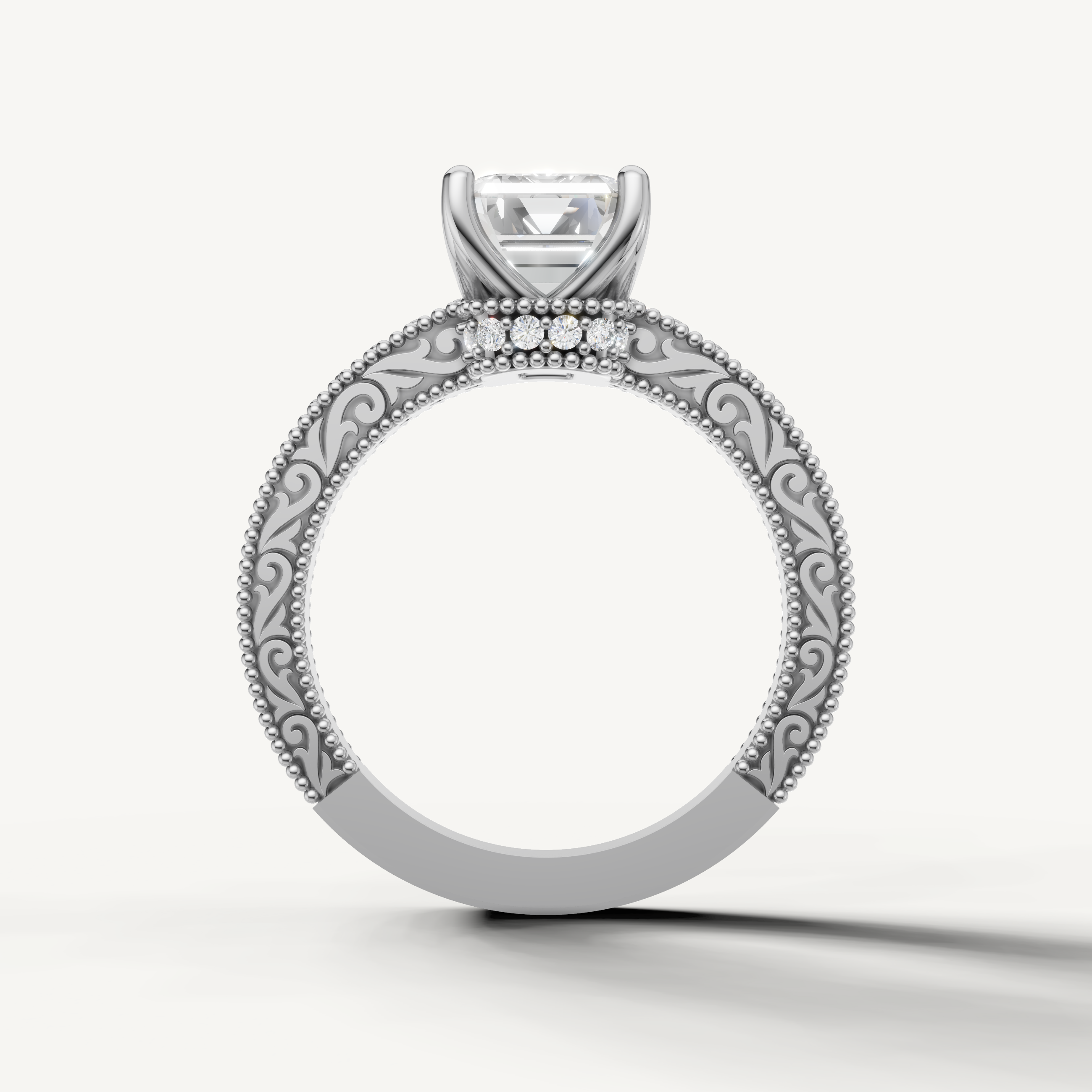 Vintage-inspired emerald cut lab grown diamond engagement ring with ornate white gold band by Raul Diamonds.