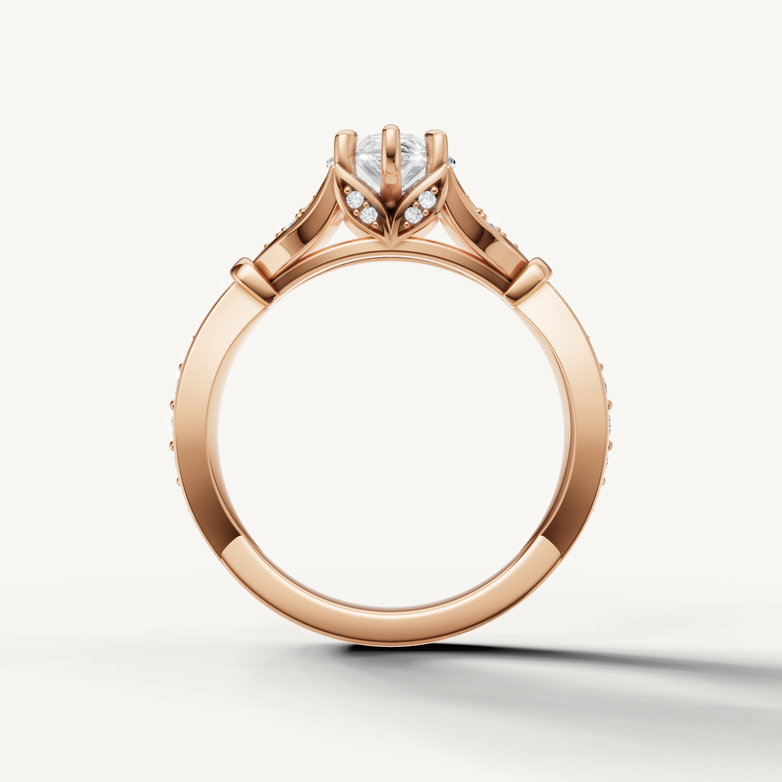 Raul Diamonds rose gold pear cut engagement ring with intricate pavé twist detailing and timeless elegance