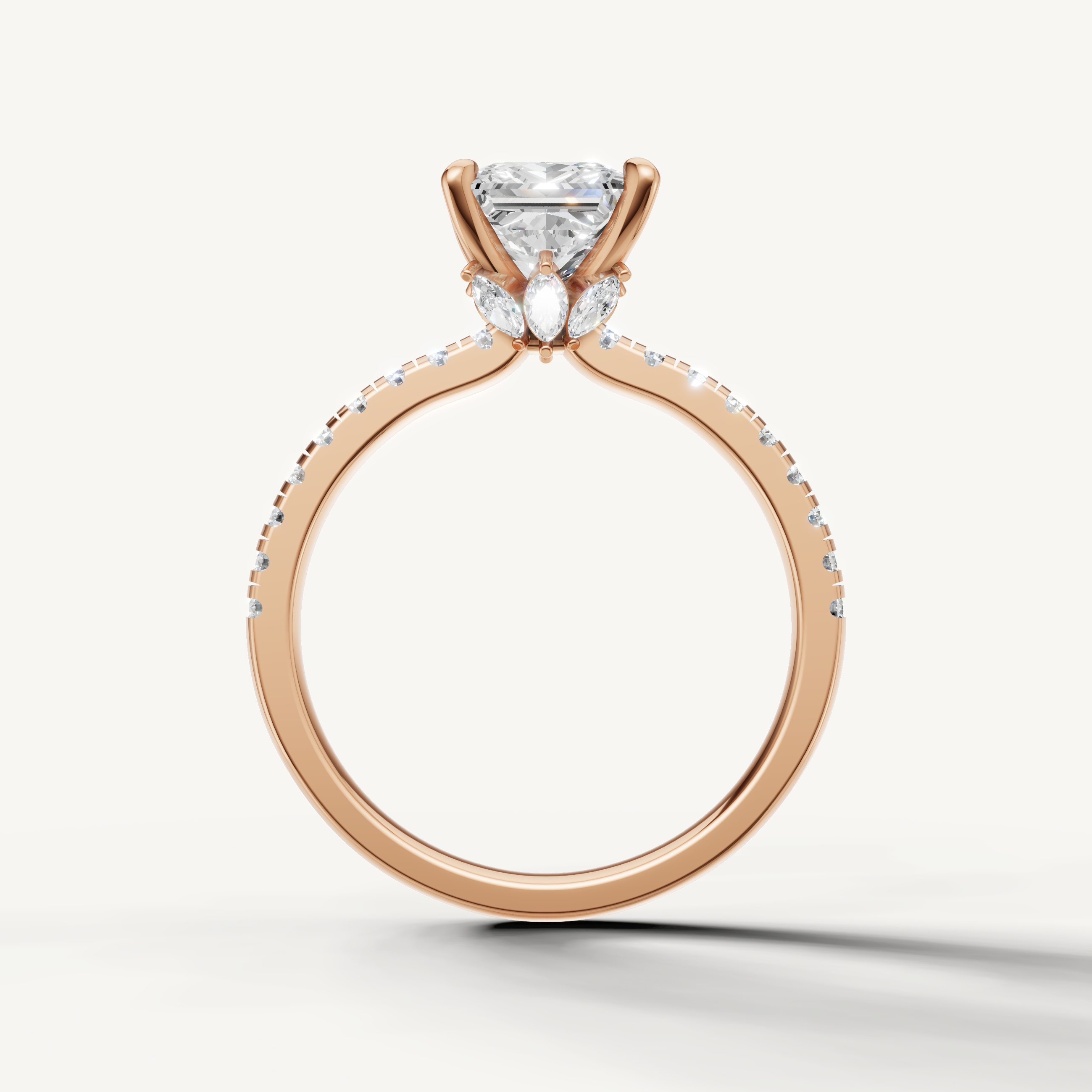 Elegant rose gold princess cut solitaire ring with a pavé-set diamond band, perfect for a modern wedding set.