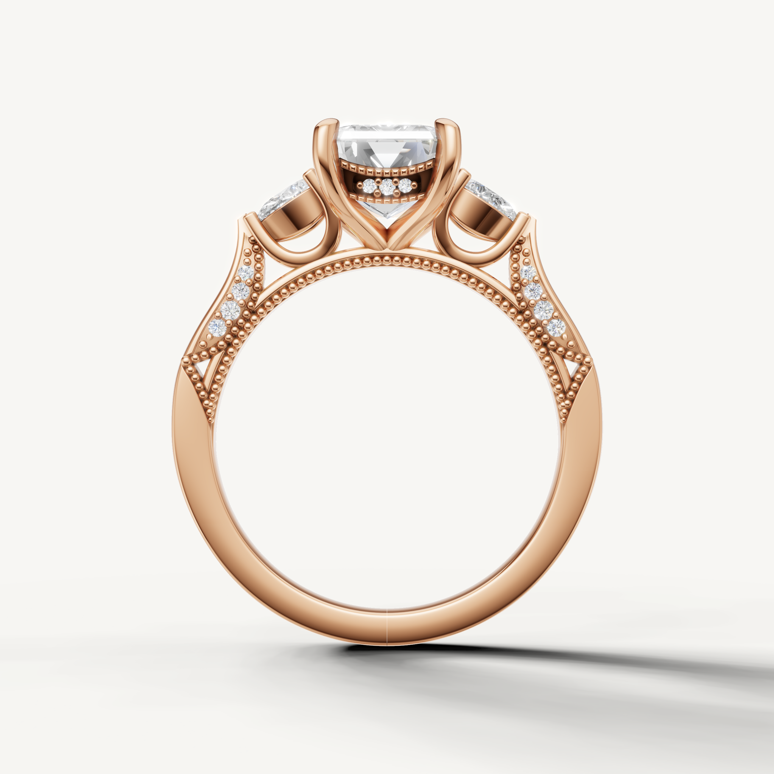 Emerald shape lab grown diamond engagement ring with side pear diamonds rose gold modern elegance