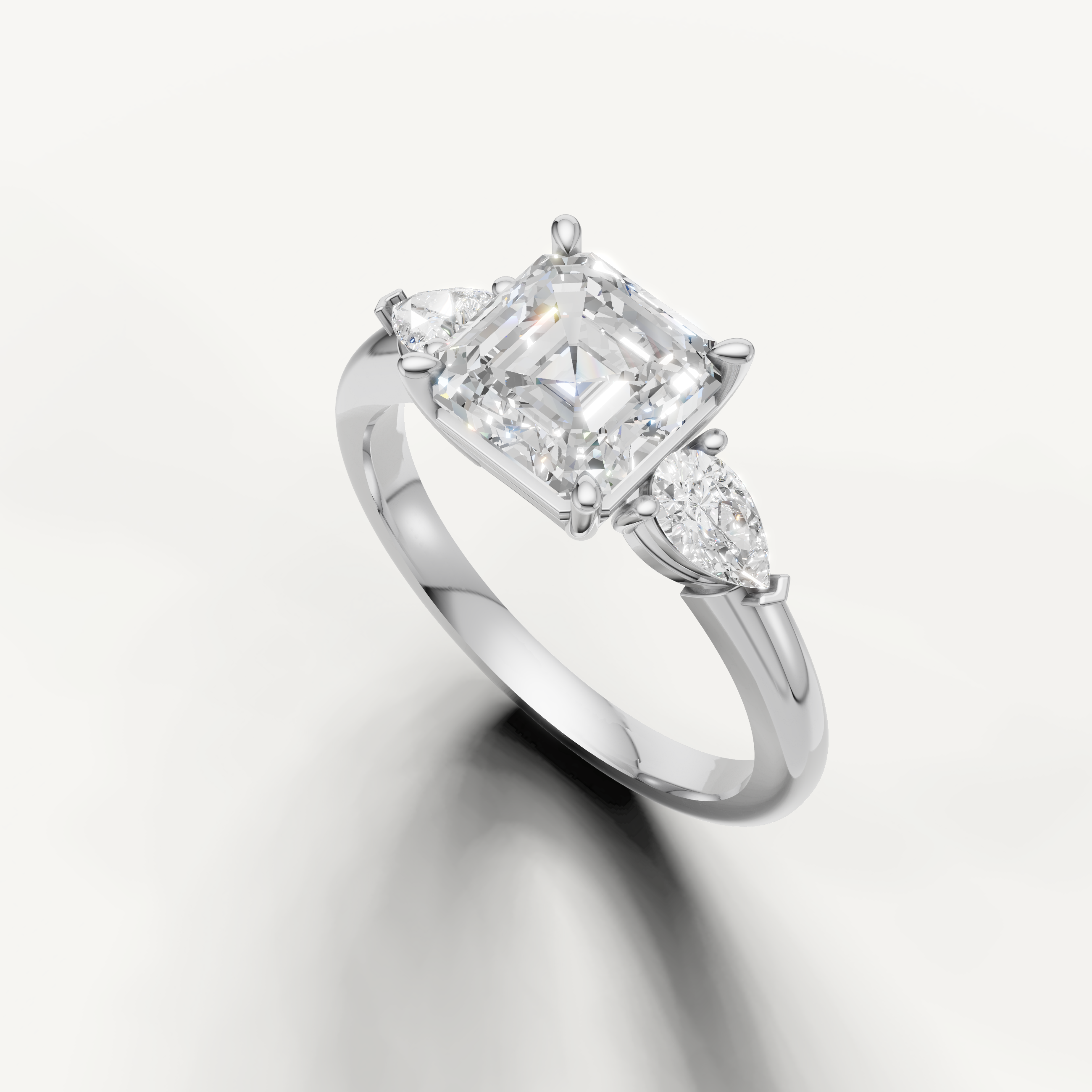 step cut asscher diamond ring with marquise side stones pear gold