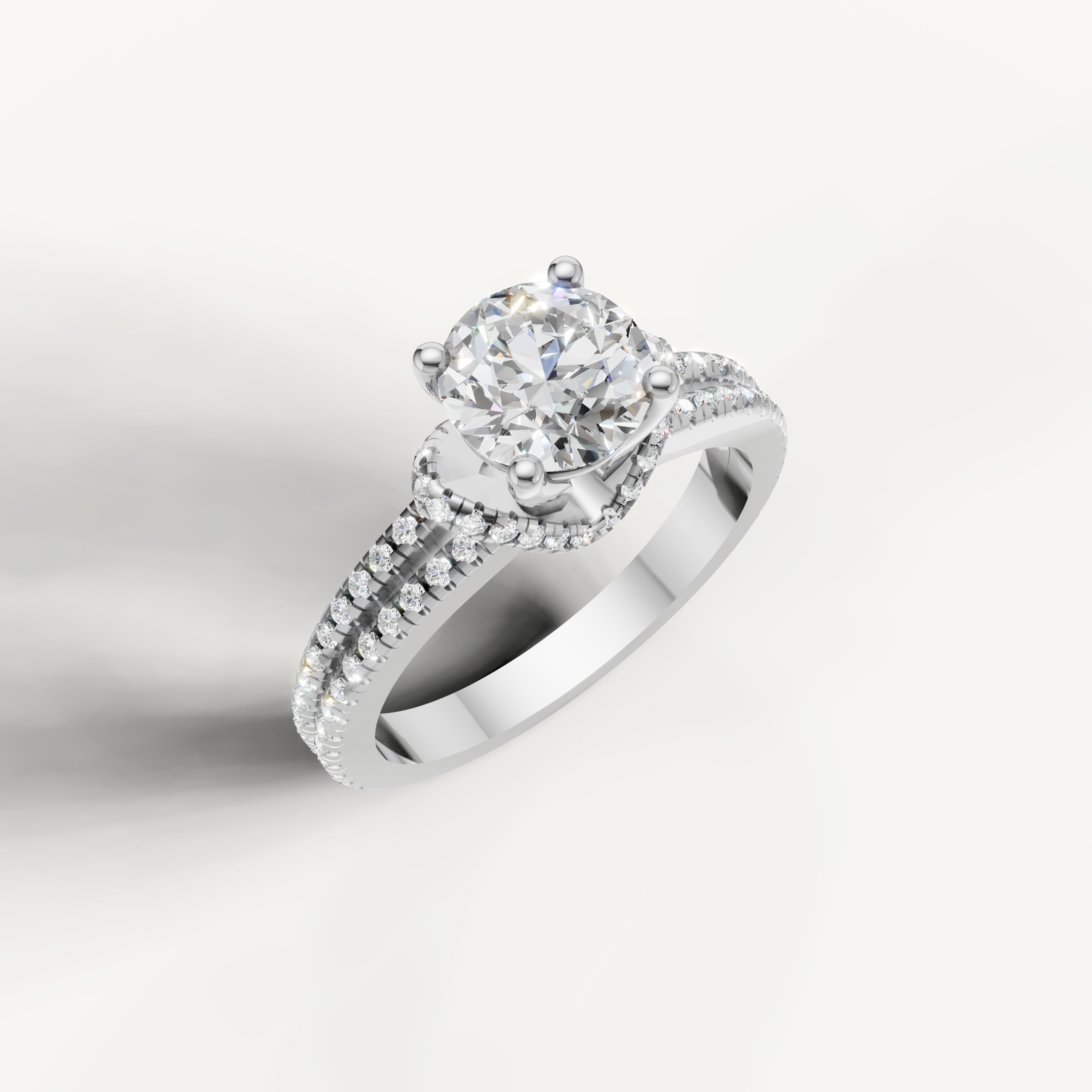 Classic white gold round solitaire bridal ring with elegant diamond accents by Raul Diamonds.