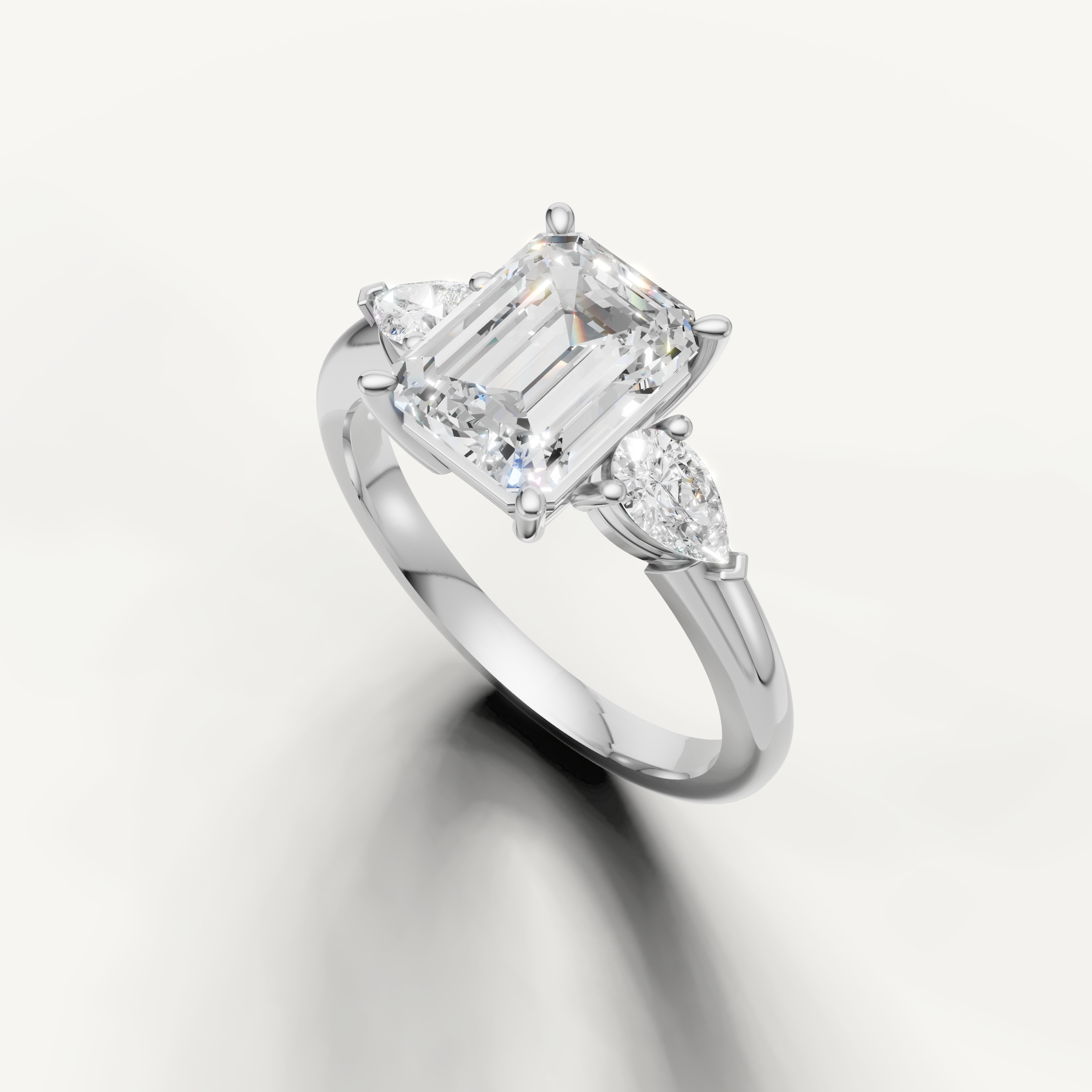 step cut emerald diamond ring with marquise side stones white gold