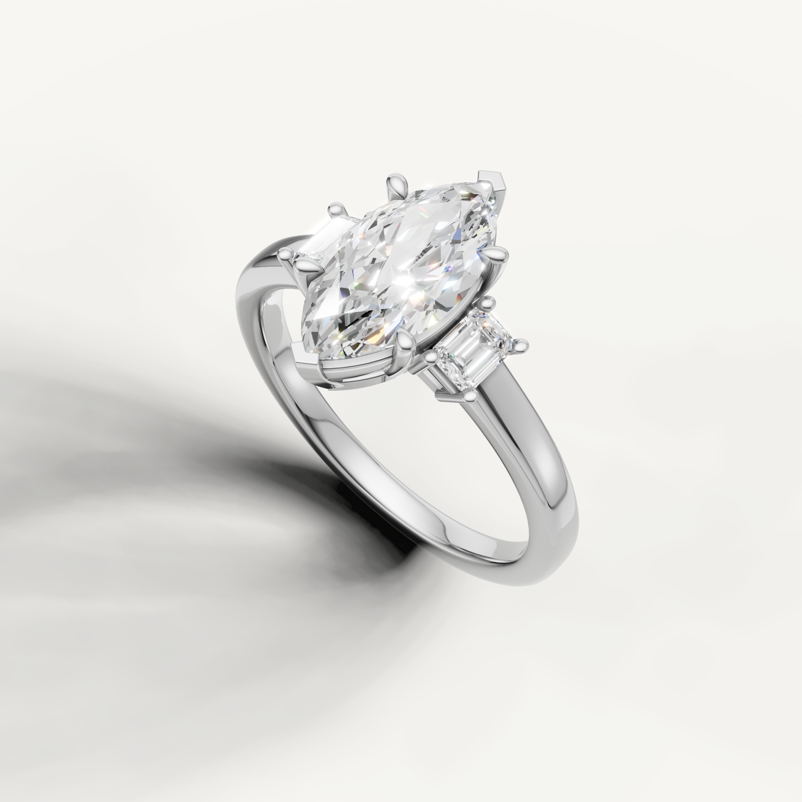 Elegant marquise cut three stone lab grown diamond ring in white gold with clean minimalist band