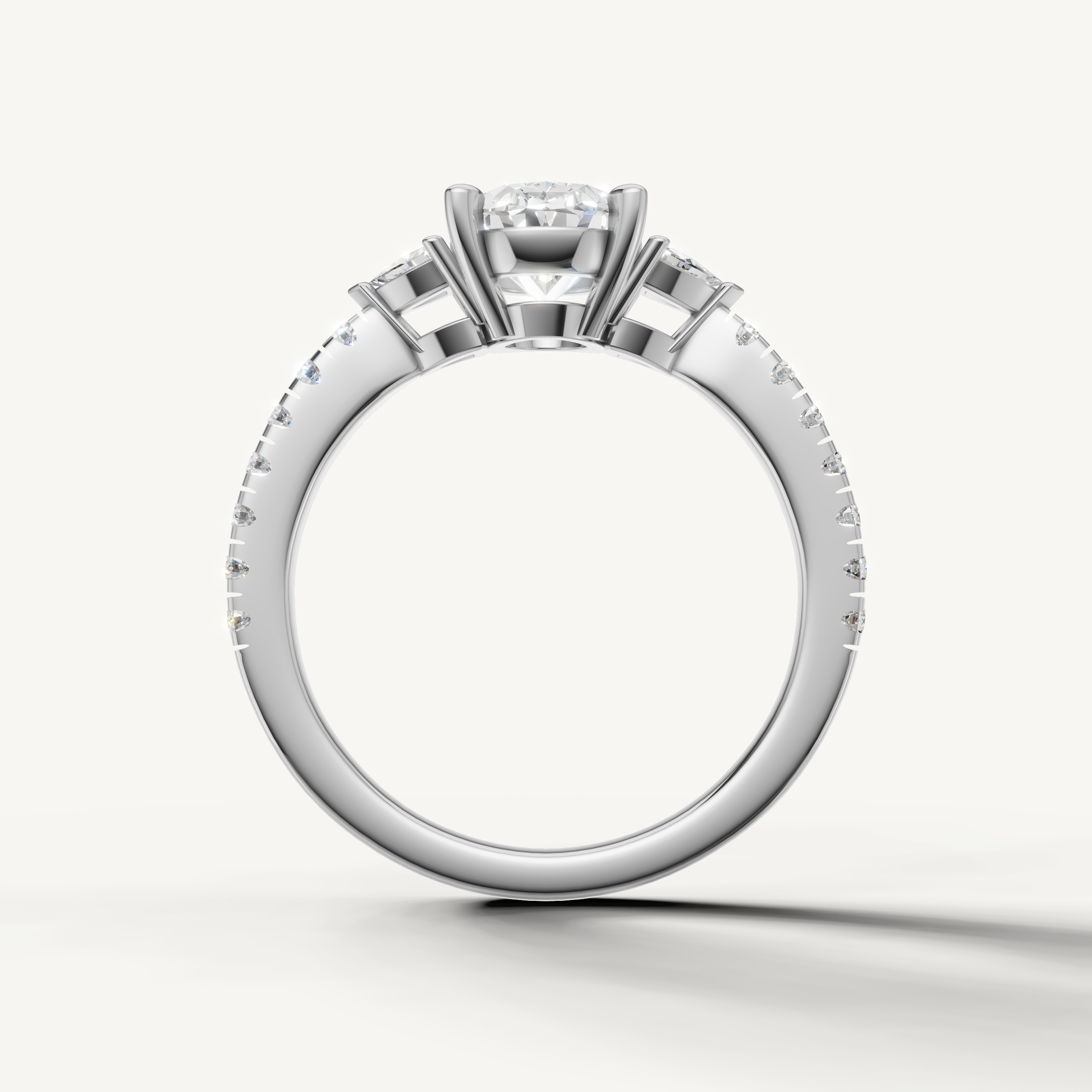Oval cut three-stone lab grown diamond engagement ring with pavé band in white gold