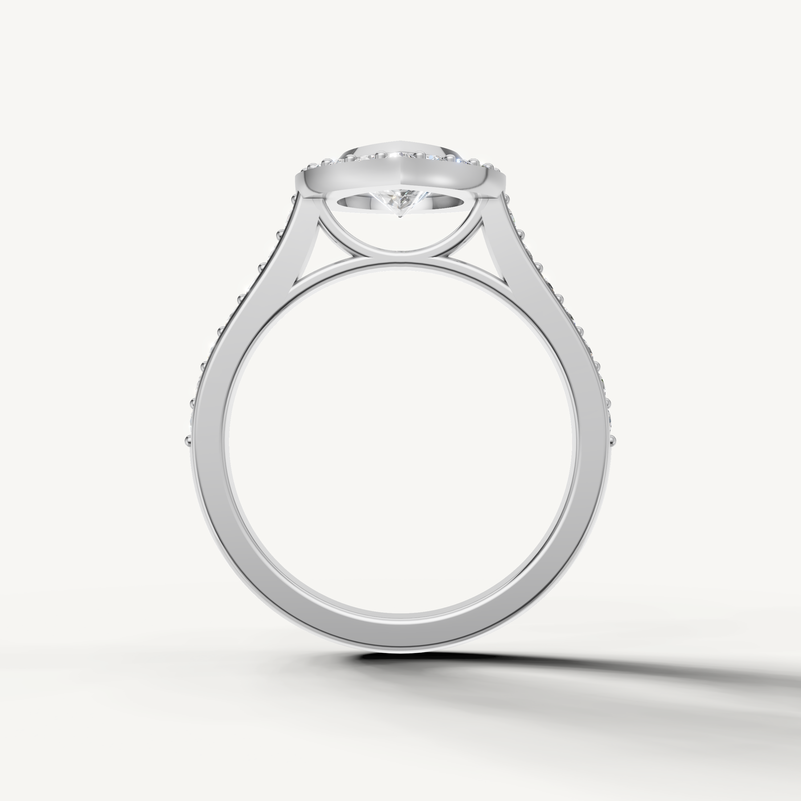 Pear center diamond ring with shimmering halo and pavé diamonds from Raul Diamonds
