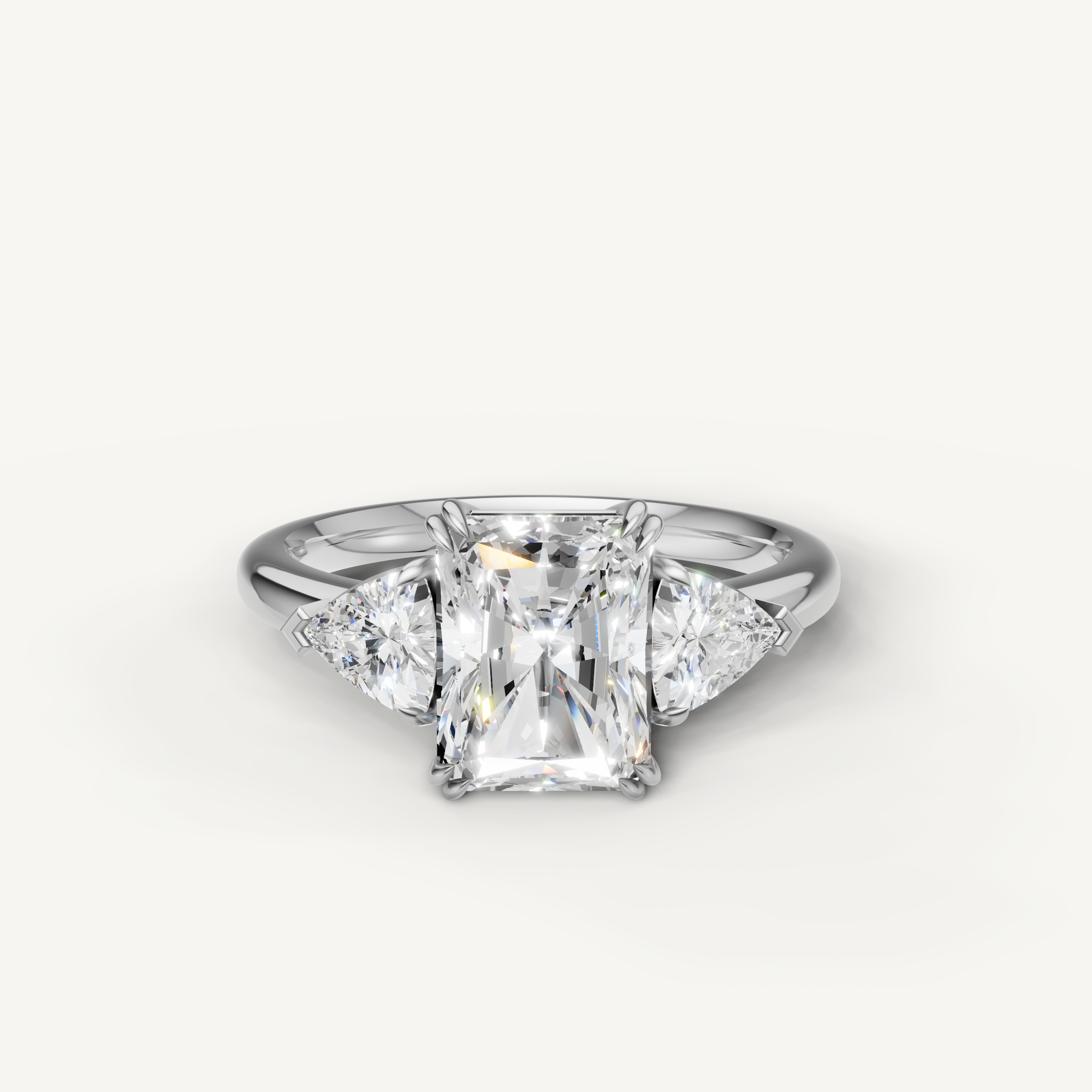 radiant cut lab grown diamond engagement ring with trillion side stones in 14k white gold