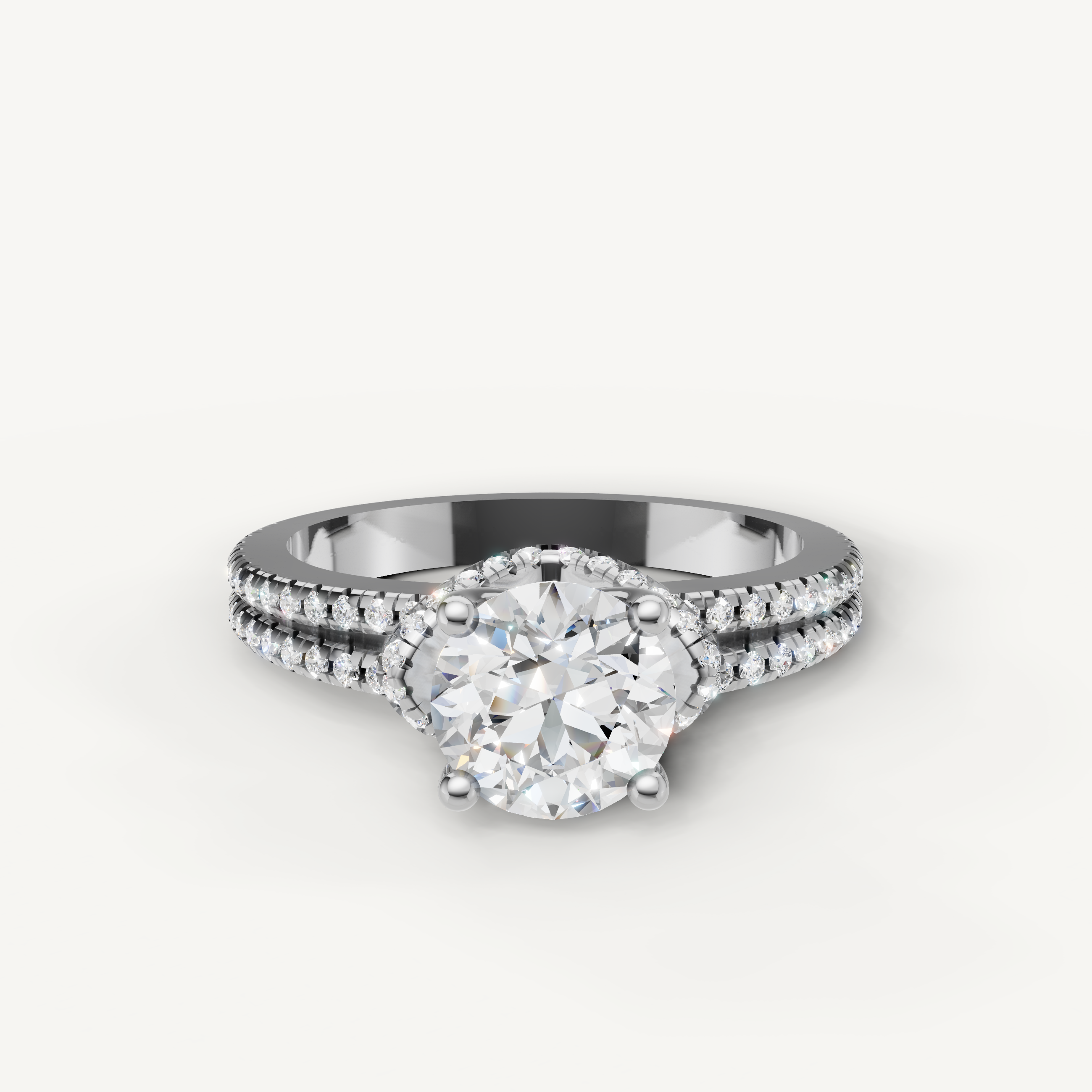  White gold round cut diamond engagement ring with sparkling pave detailing from Raul Diamonds.