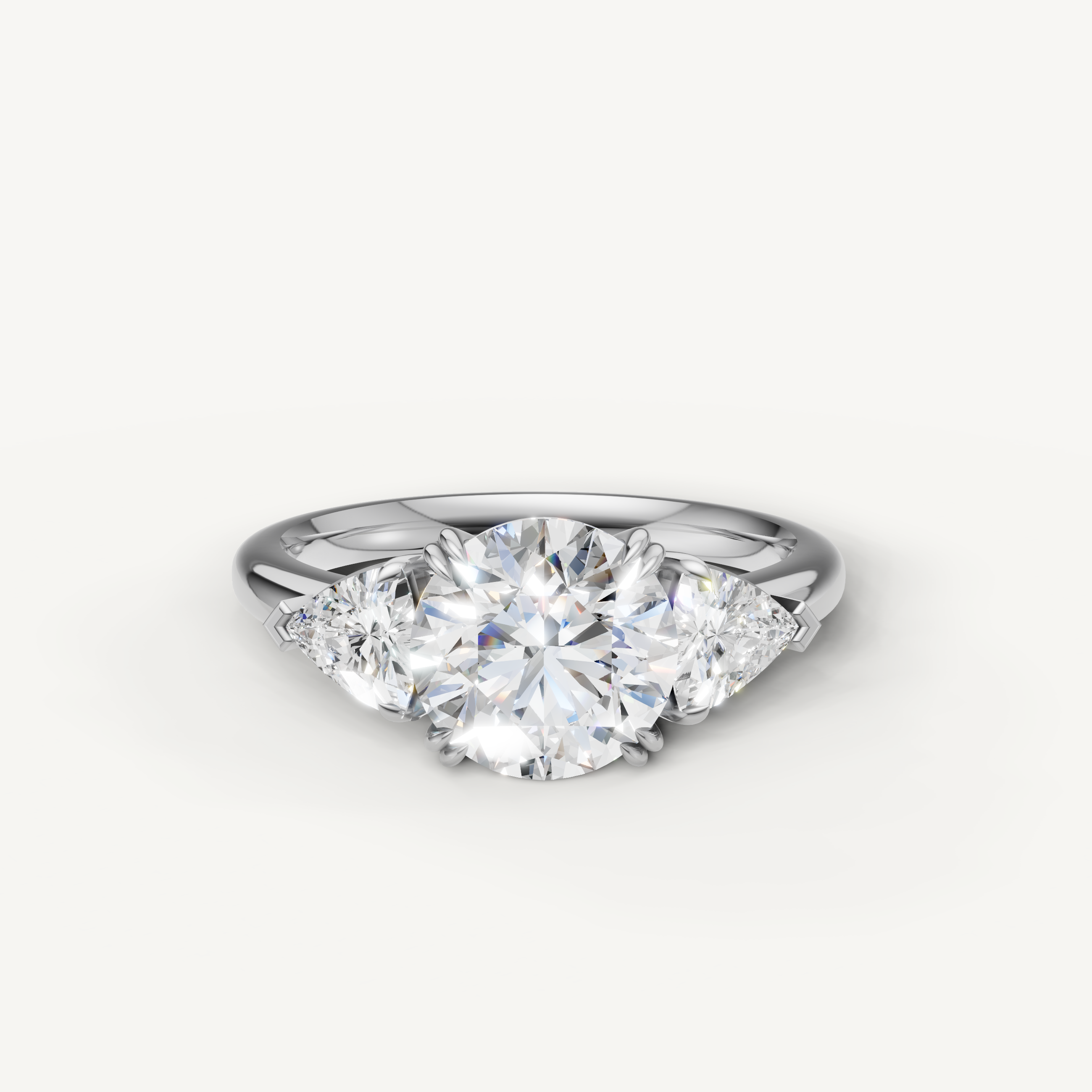 round brilliant lab grown diamond engagement ring with trillion side stones in 14k white gold
