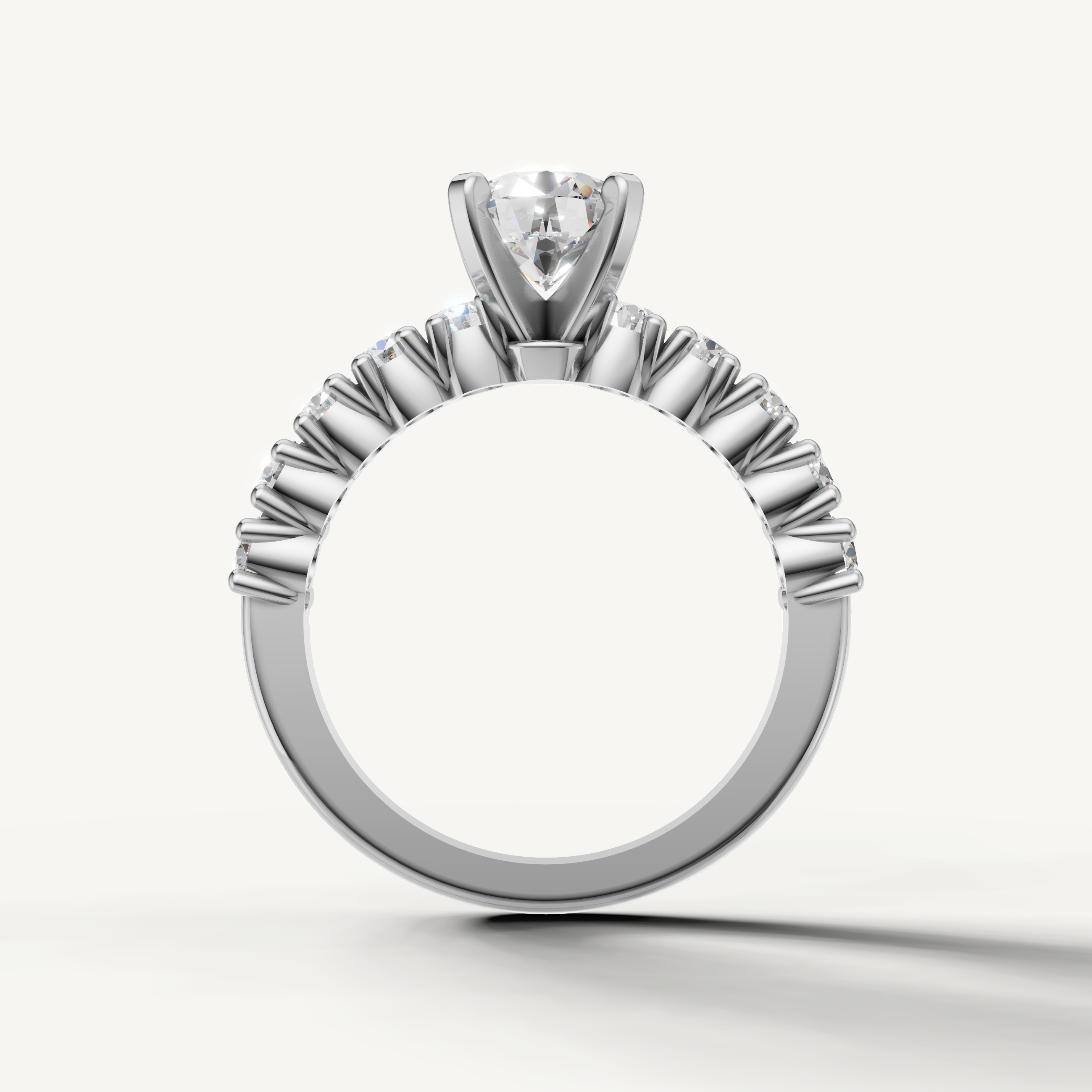 Round center diamond ring with sparkling side stones from Raul Diamonds