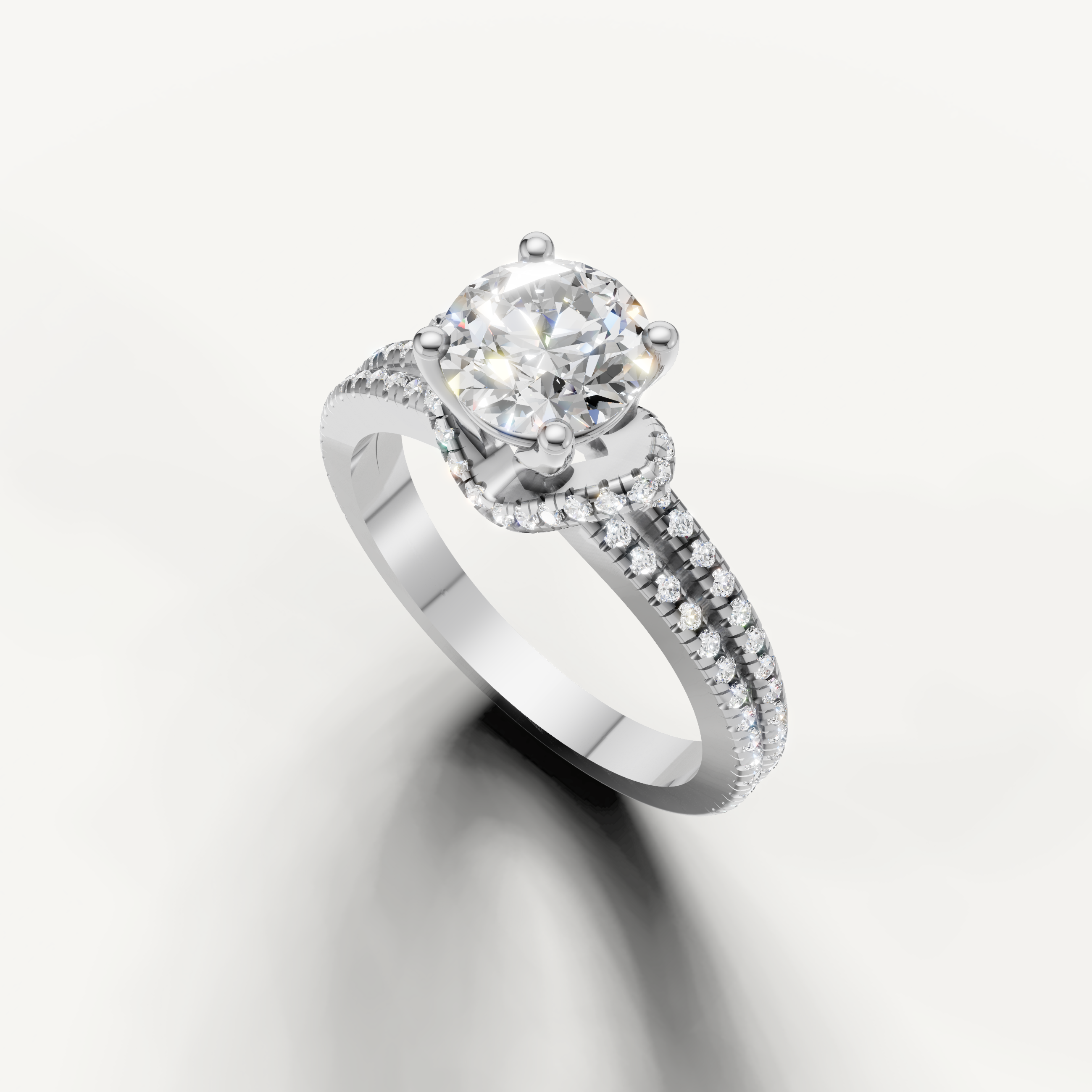 White gold round diamond solitaire ring with pave split shank crafted by Raul Diamonds.