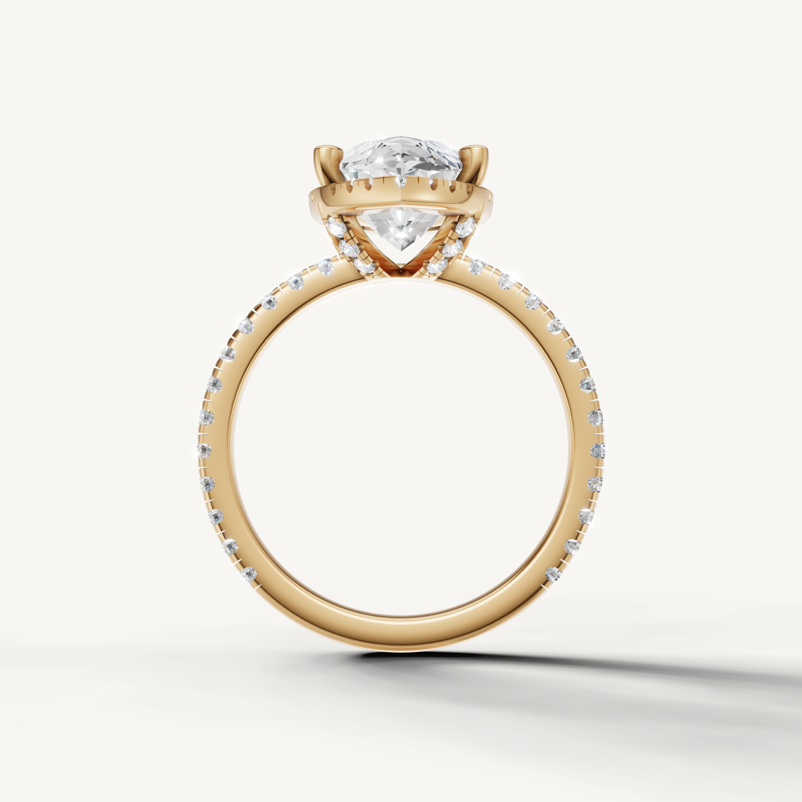Marquise shape engagement ring with pavé band and hidden halo yellow gold classic style