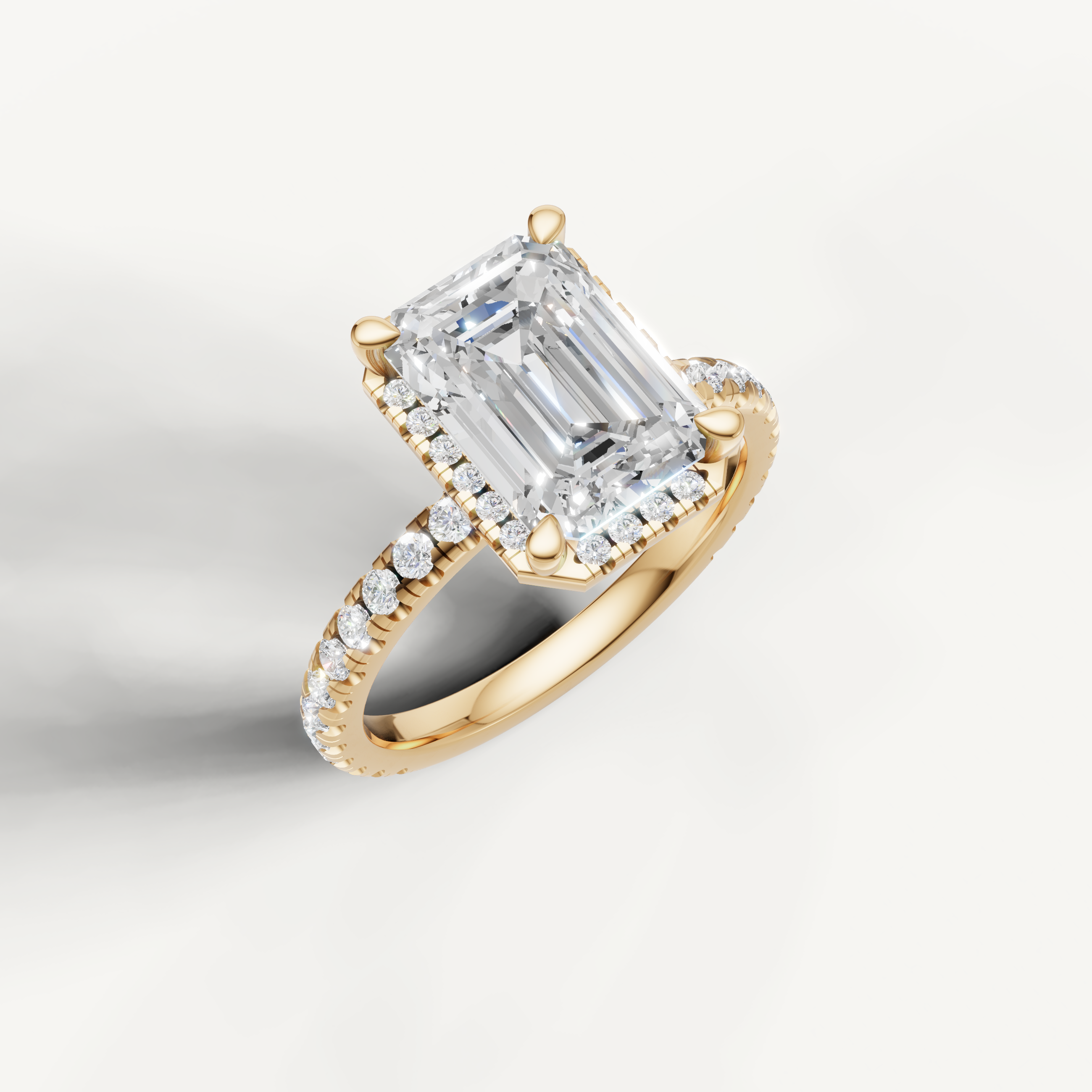 IGI certified emerald cut lab diamond ring with hidden halo and pavé yellow gold setting