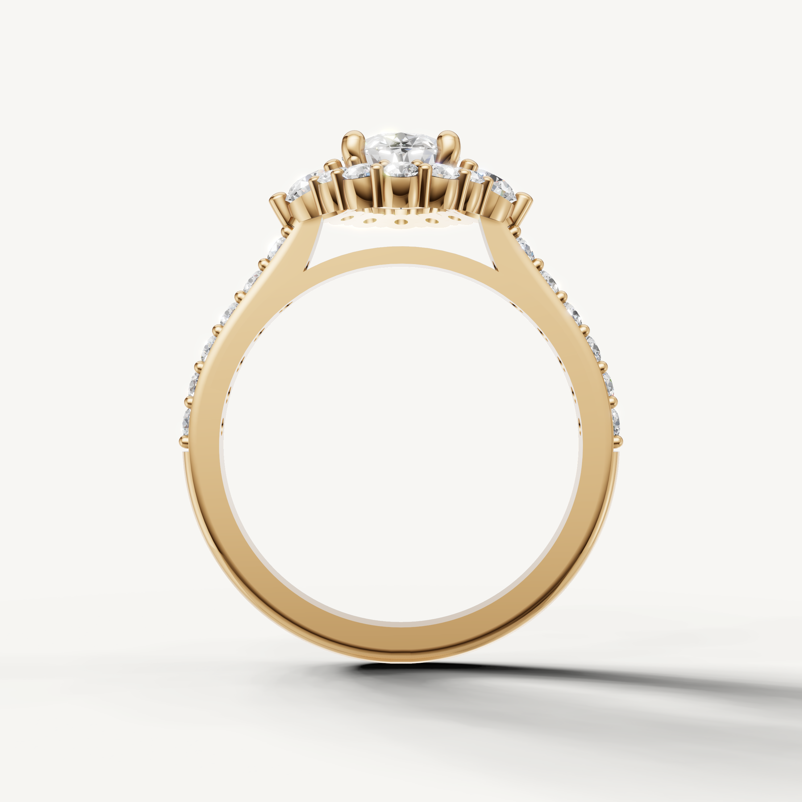 Elegant yellow gold oval halo ring with round accent diamonds by Raul Diamonds
