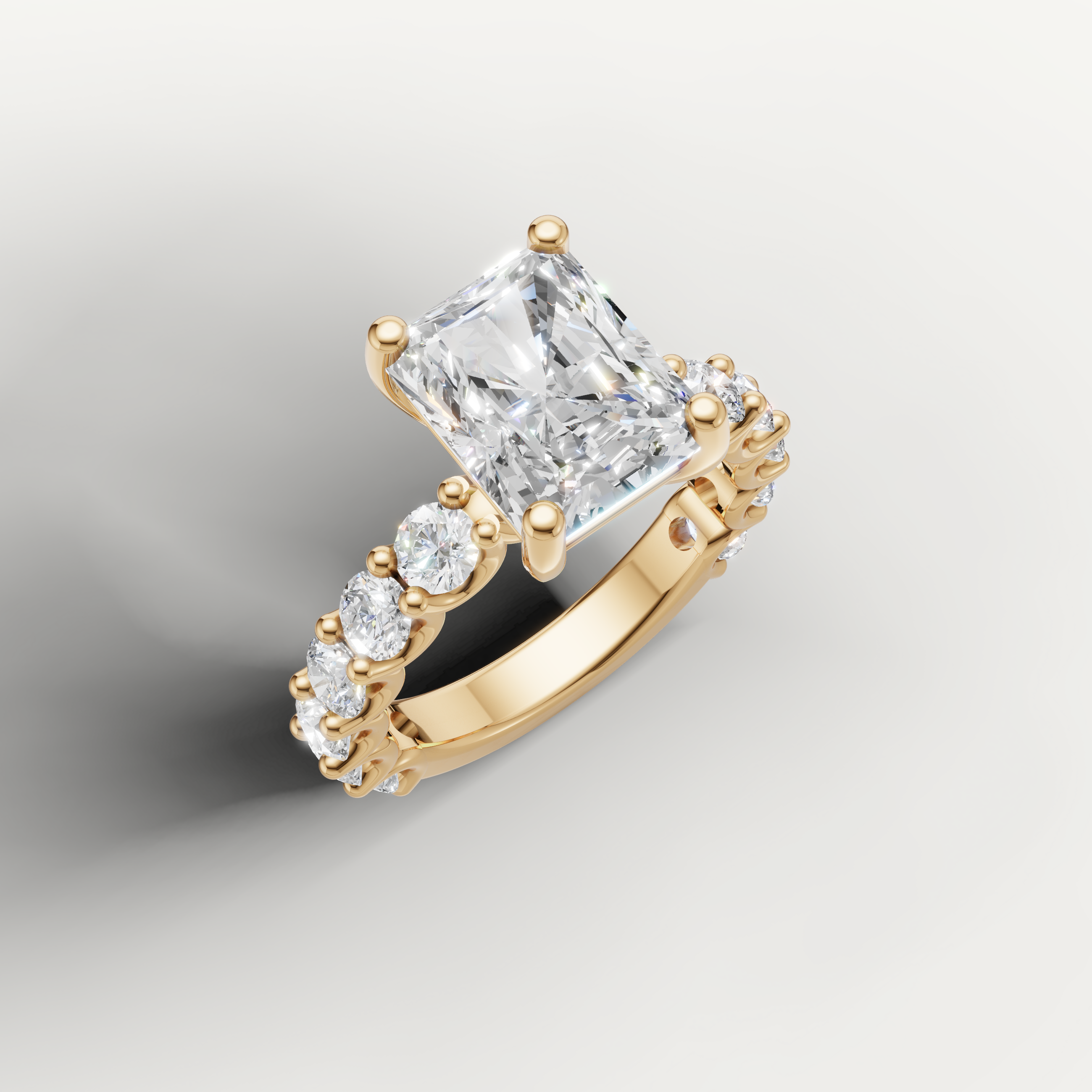 IGI certified radiant cut lab diamond ring profile with round side stones yellow gold
