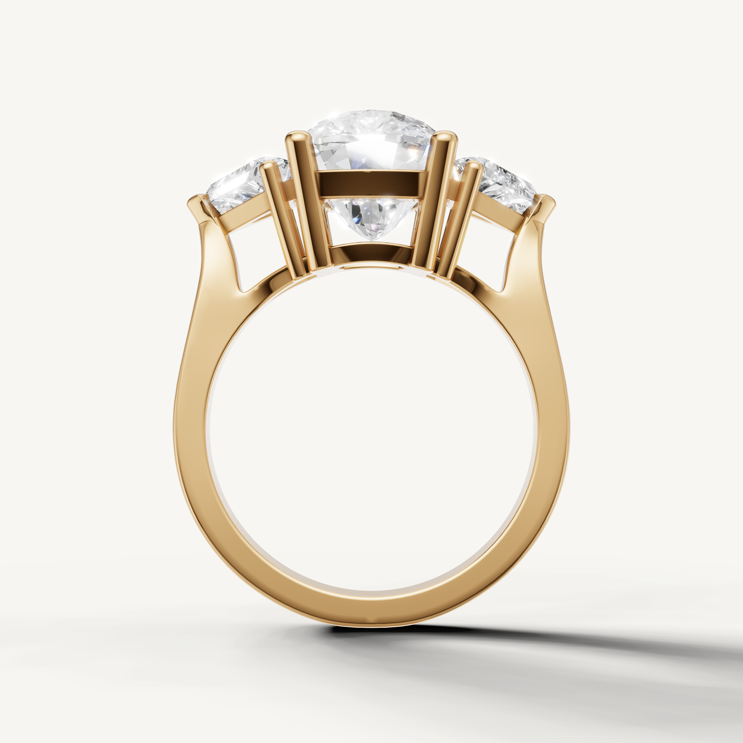 Elegant yellow gold round solitaire ring with side stones by Raul Diamonds