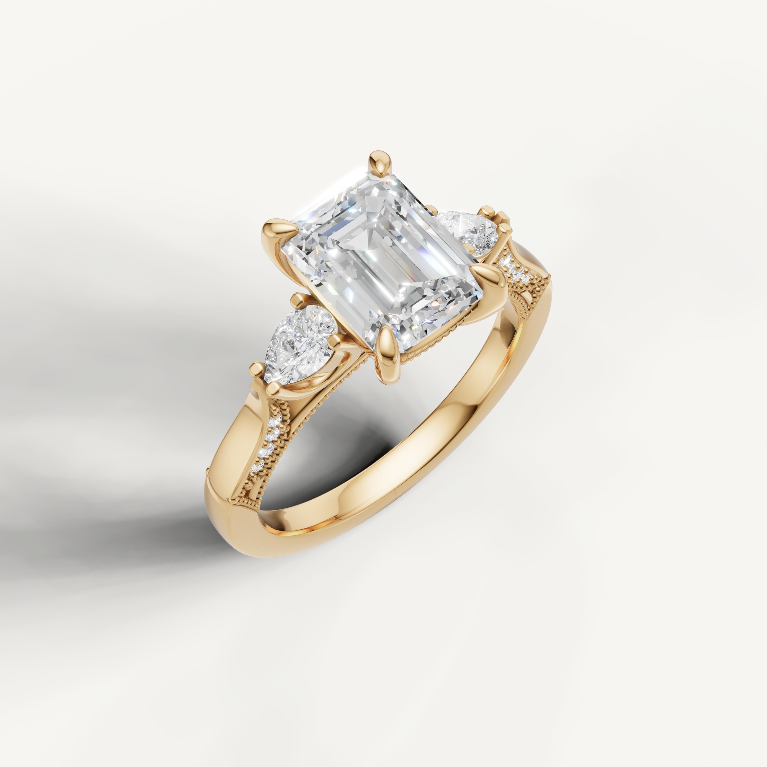 IGI certified emerald cut lab diamond ring with pear accents and pavé split band yellow gold