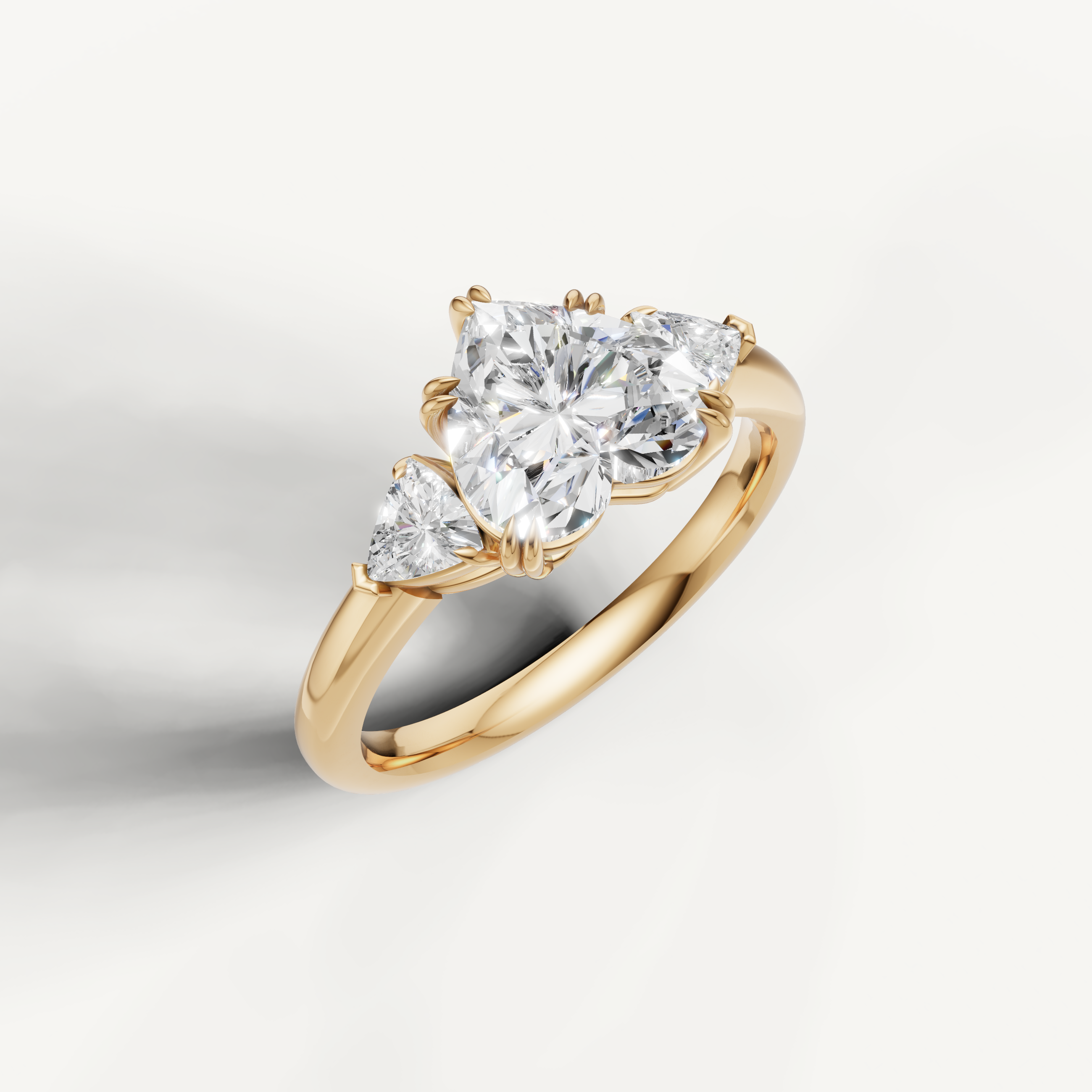 romantic heart cut lab grown diamond trilogy ring with trillion accents in yellow gold